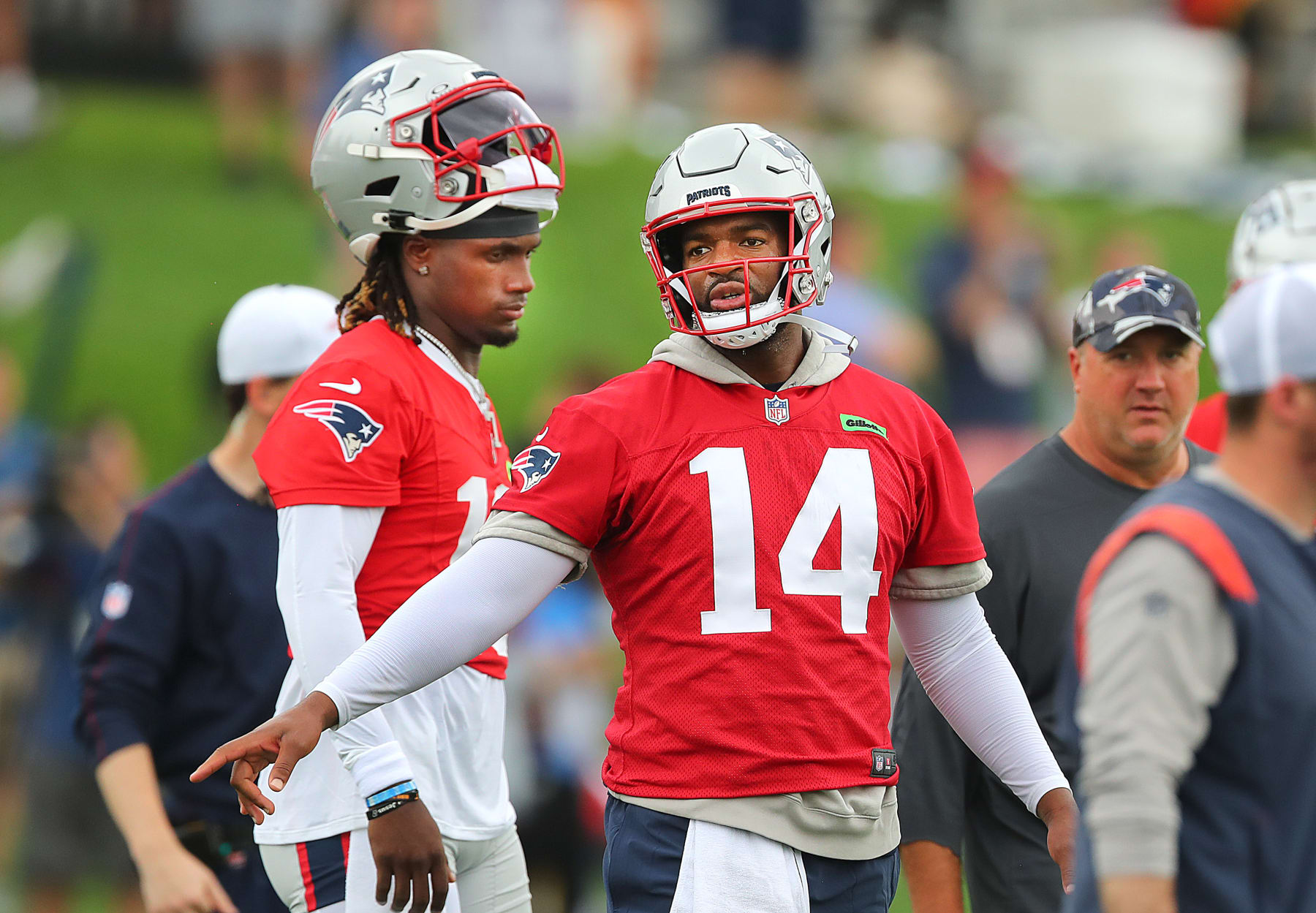 Foxborough, MA - July 25: New England Patriots QB Joe Milton III, left, and Jacoby Brissett rest between drills. (Photo by John Tlumacki/The Boston Globe via Getty Images)
