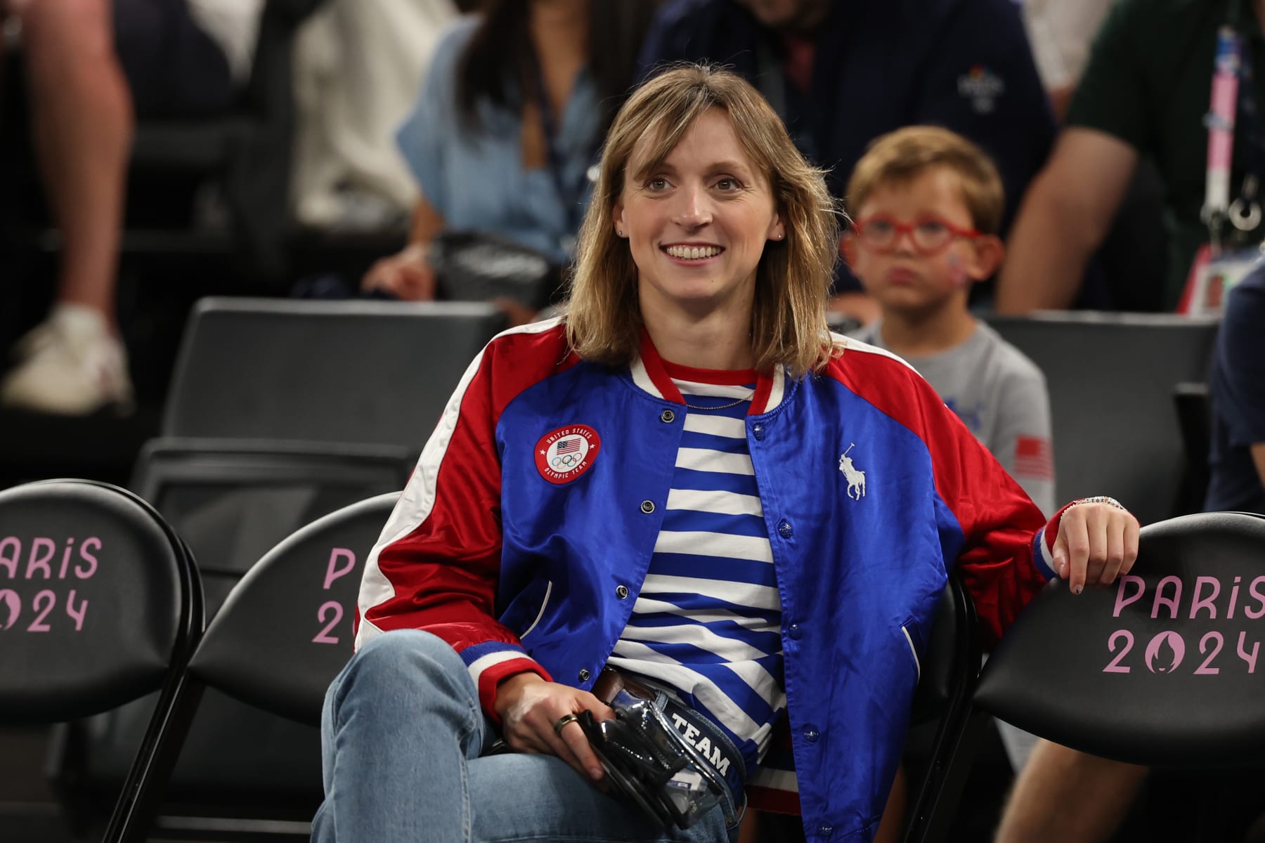 PARIS, FRANCE - AUGUST 07: United States swimmer Katie Ledecky looks on before a Women's basketball quarterfinal game between Team United States and Team Nigeria on day twelve of the Olympic Games Paris 2024 at Bercy Arena on August 07, 2024 in Paris, France. (Photo by Ezra Shaw/Getty Images)