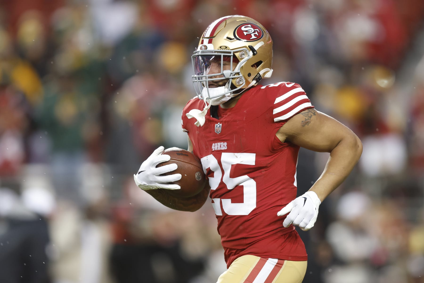 SANTA CLARA, CALIFORNIA - JANUARY 20: Elijah Mitchell #25 of the San Francisco 49ers warms up before the NFC Divisional Playoffs against the Green Bay Packers at Levi's Stadium on January 20, 2024 in Santa Clara, California. (Photo by Lachlan Cunningham/Getty Images)