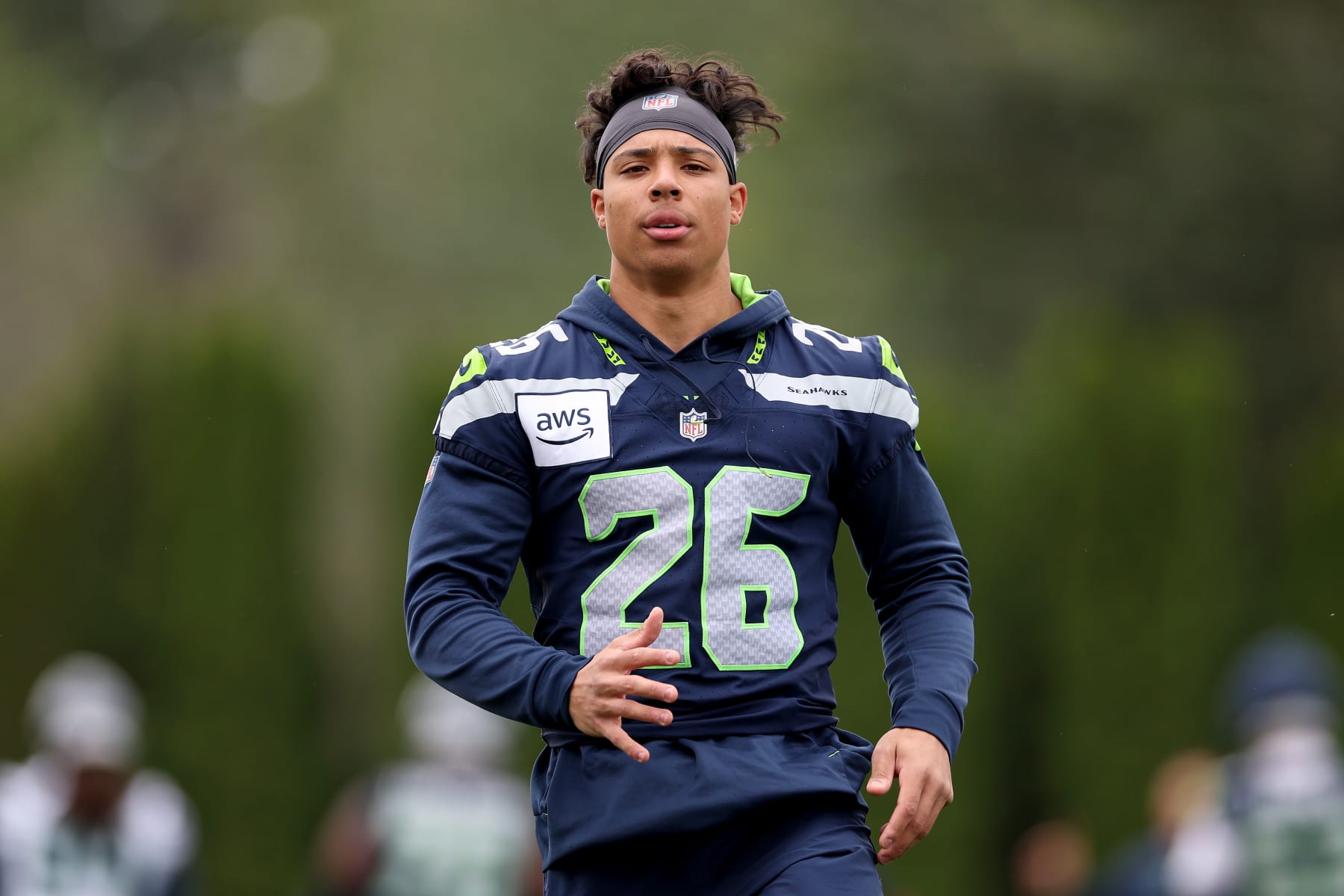 RENTON, WASHINGTON - JUNE 03: Zach Charbonnet #26 of the Seattle Seahawks works out during practice at Virginia Mason Athletic Center on June 03, 2024 in Renton, Washington. (Photo by Steph Chambers/Getty Images)