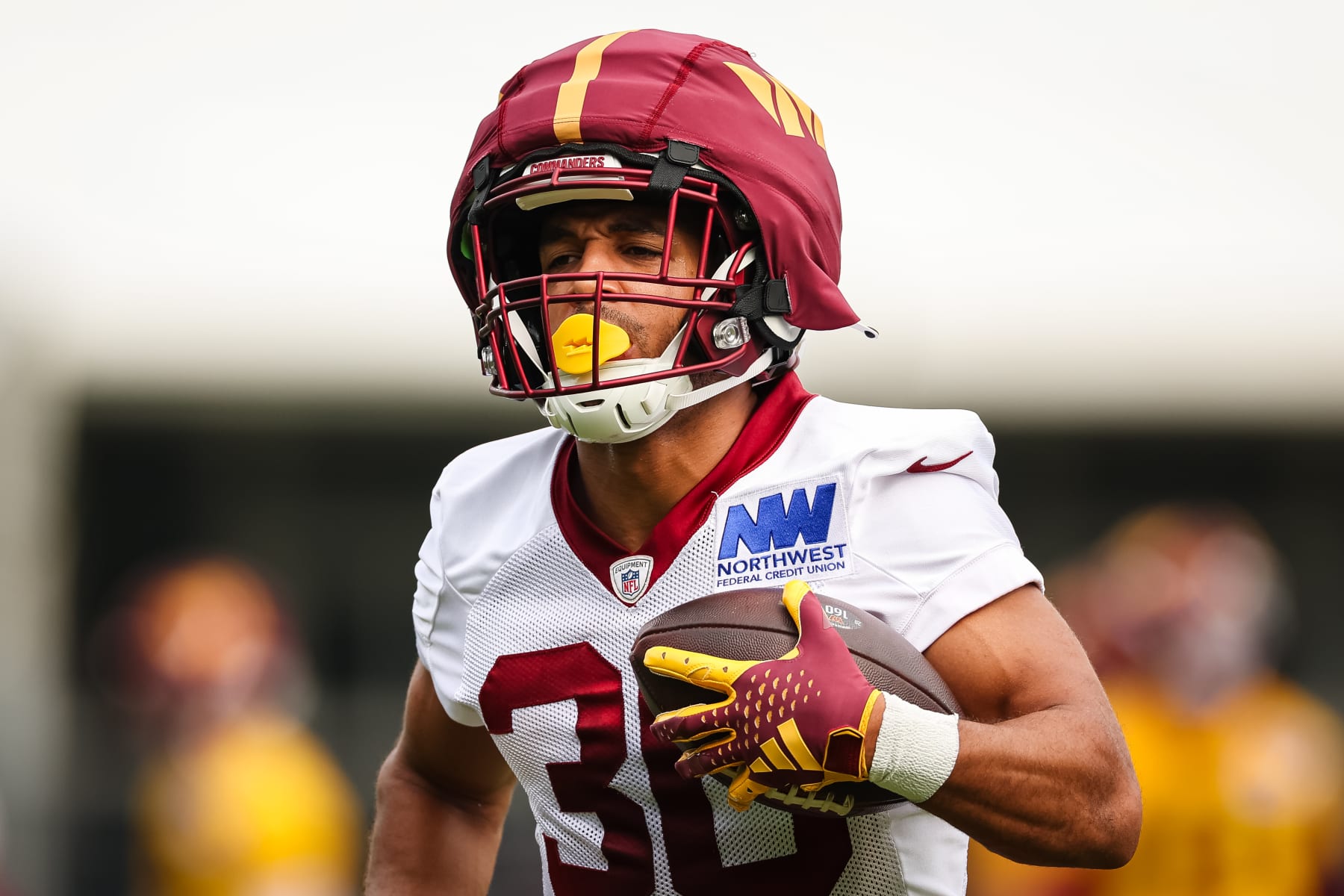 ASHBURN, VA - JULY 25: Austin Ekeler #30 of the Washington Commanders participates in a drill during training camp at OrthoVirginia Training Center at Commanders Park on July 25, 2024 in Ashburn, Virginia. (Photo by Scott Taetsch/Getty Images)