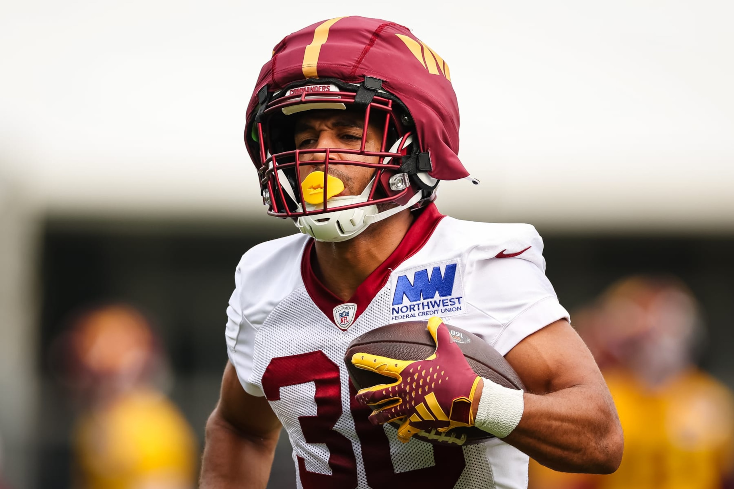 ASHBURN, VA - JULY 25: Austin Ekeler #30 of the Washington Commanders participates in a drill during training camp at OrthoVirginia Training Center at Commanders Park on July 25, 2024 in Ashburn, Virginia. (Photo by Scott Taetsch/Getty Images)