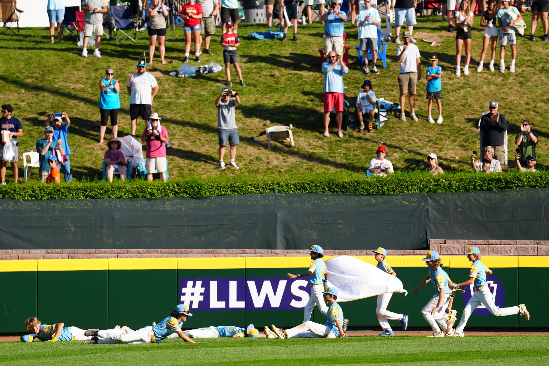 WILLIAMSPORT, PA - AUGUST 27:  Members of the West Region team from El Segundo, California celebrates with his coach after defeating the Caribbean Region team from Willemstad, Curacao in the Little League World Series Championship Game at Little League World Series Complex on Sunday, August 27, 2023 in Williamsport, Pennsylvania. (Photo by Joe Faraoni/MLB Photos via Getty Images)