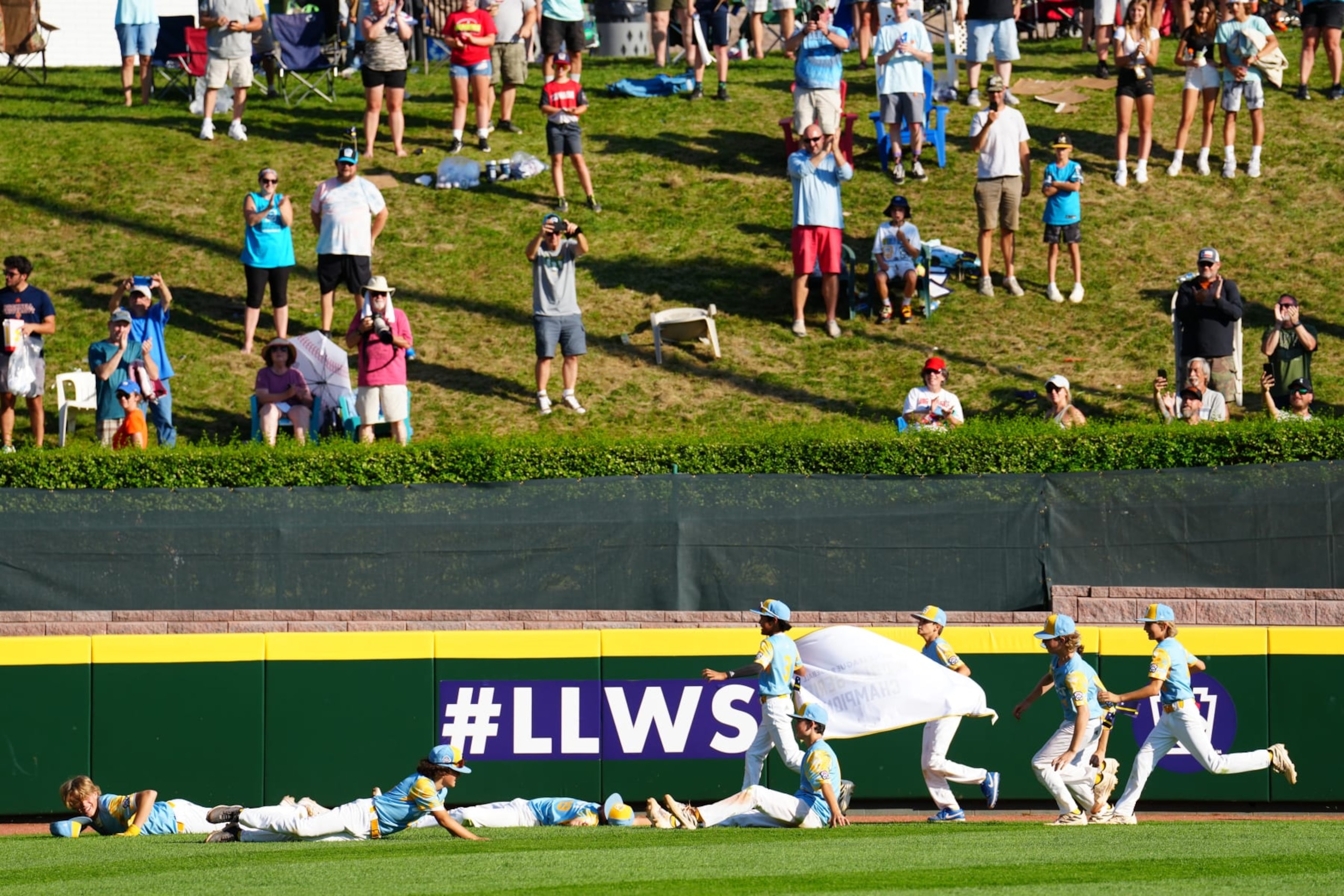 WILLIAMSPORT, PA - AUGUST 27:  Members of the West Region team from El Segundo, California celebrates with his coach after defeating the Caribbean Region team from Willemstad, Curacao in the Little League World Series Championship Game at Little League World Series Complex on Sunday, August 27, 2023 in Williamsport, Pennsylvania. (Photo by Joe Faraoni/MLB Photos via Getty Images)