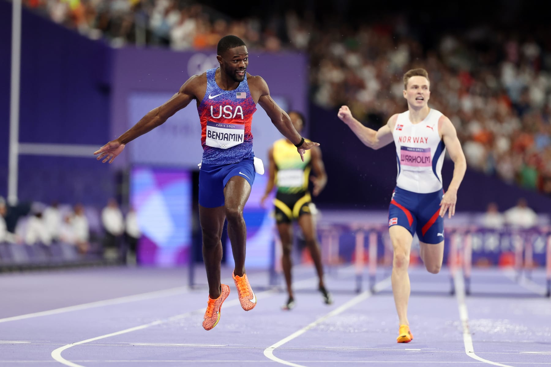 PARIS, FRANCE - AUGUST 09: Rai Benjamin of Team United States celebrates winning the Gold medal during the Men's 400m Hurdles Final on day fourteen of the Olympic Games Paris 2024 at Stade de France on August 09, 2024 in Paris, France. (Photo by Hannah Peters/Getty Images)