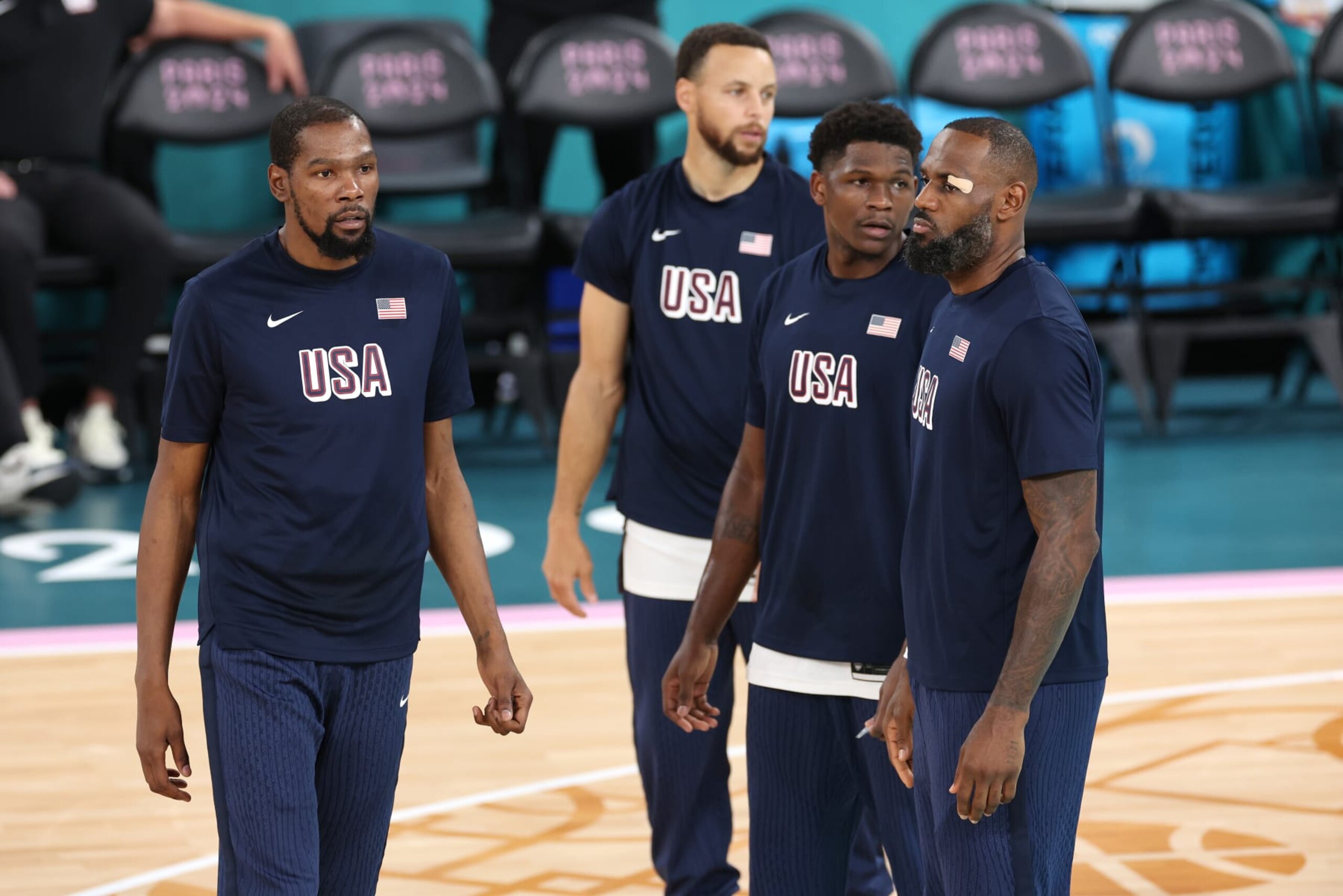 PARIS, FRANCE - AUGUST 08: Kevin Durant, Stephen Curry, Anthony Edwards, and Lebron James of Team United States look on prior to a Men's basketball semifinals match between Team United States and Team Serbia on day thirteen of the Olympic Games Paris 2024 at Bercy Arena on August 08, 2024 in Paris, France. (Photo by Sarah Stier/Getty Images)