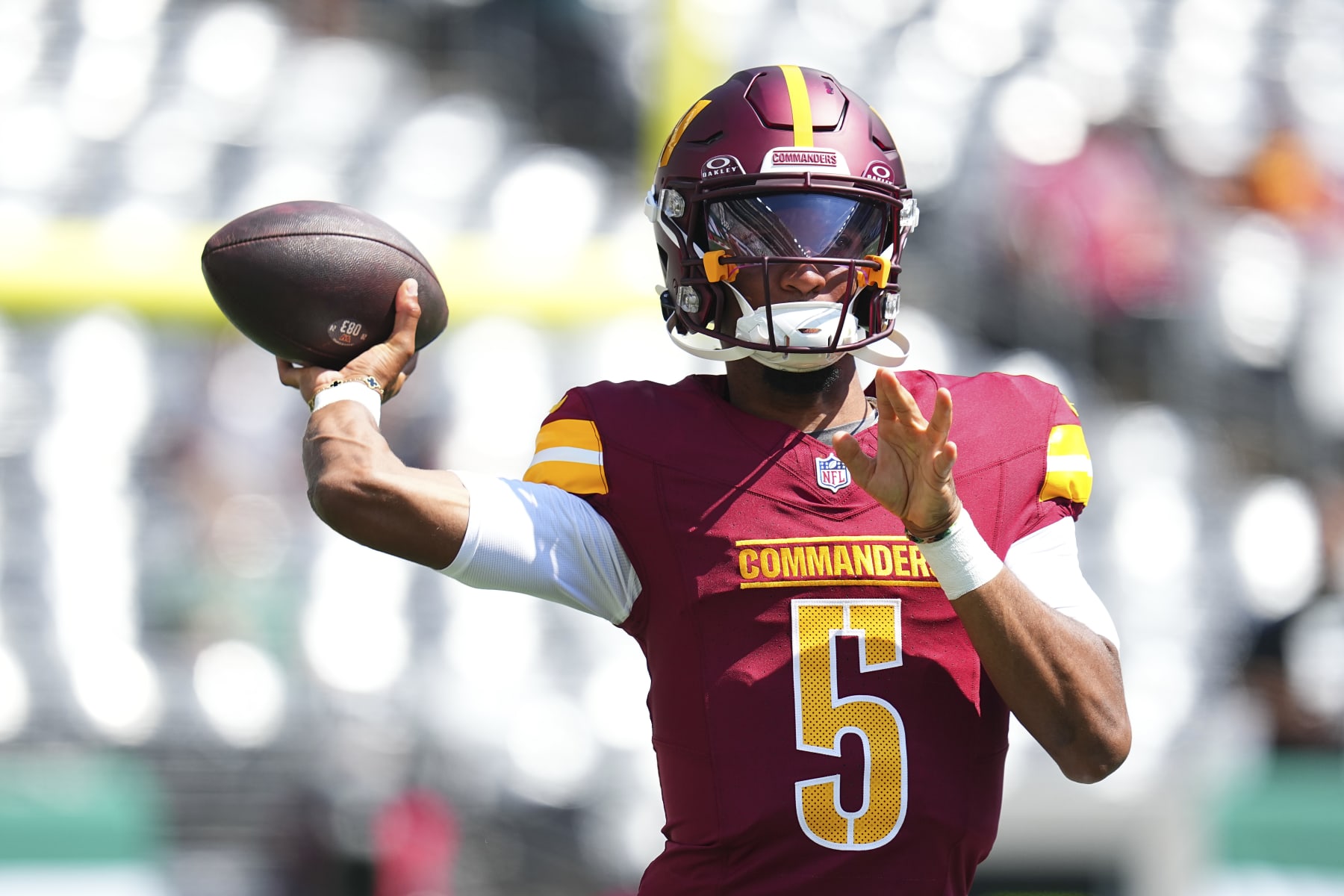 EAST RUTHERFORD, NEW JERSEY - AUGUST 10: Jayden Daniels #5 of the Washington Commanders warms up prior to the preseason game against the New York Jets at MetLife Stadium on August 10, 2024 in East Rutherford, New Jersey. (Photo by Mitchell Leff/Getty Images)