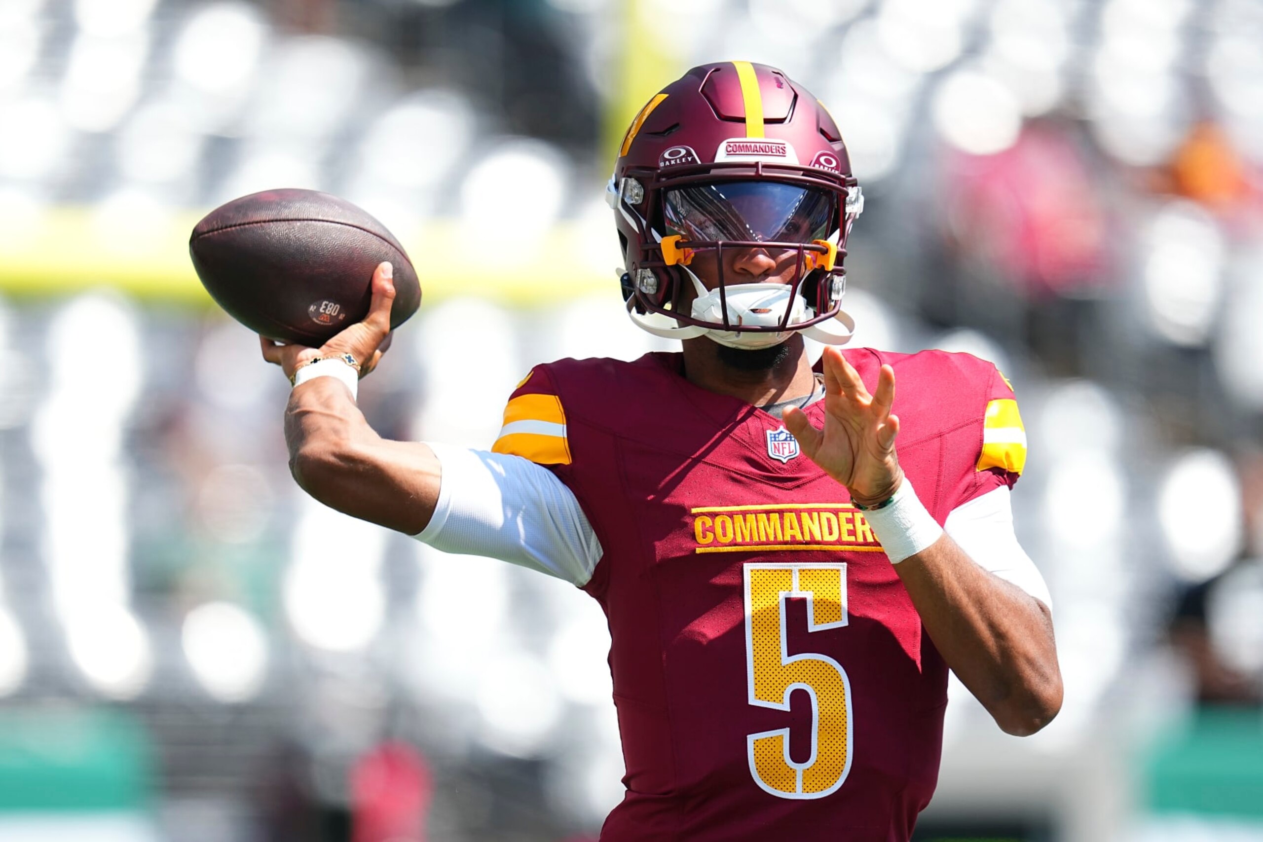 EAST RUTHERFORD, NEW JERSEY - AUGUST 10: Jayden Daniels #5 of the Washington Commanders warms up prior to the preseason game against the New York Jets at MetLife Stadium on August 10, 2024 in East Rutherford, New Jersey. (Photo by Mitchell Leff/Getty Images)