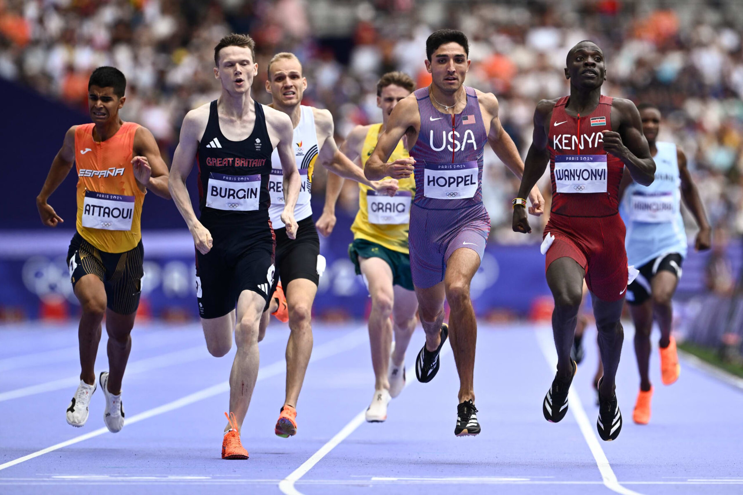 Spain's Mohamed Attaoui, Britain's Max Burgin, Australia's Peyton Craig, US' Bryce Hoppel and Kenya's Emmanuel Wanyonyi compete in the men's 800m semi-final of the athletics event at the Paris 2024 Olympic Games at Stade de France in Saint-Denis, north of Paris, on August 9, 2024. (Photo by Jewel SAMAD / AFP) (Photo by JEWEL SAMAD/AFP via Getty Images)
