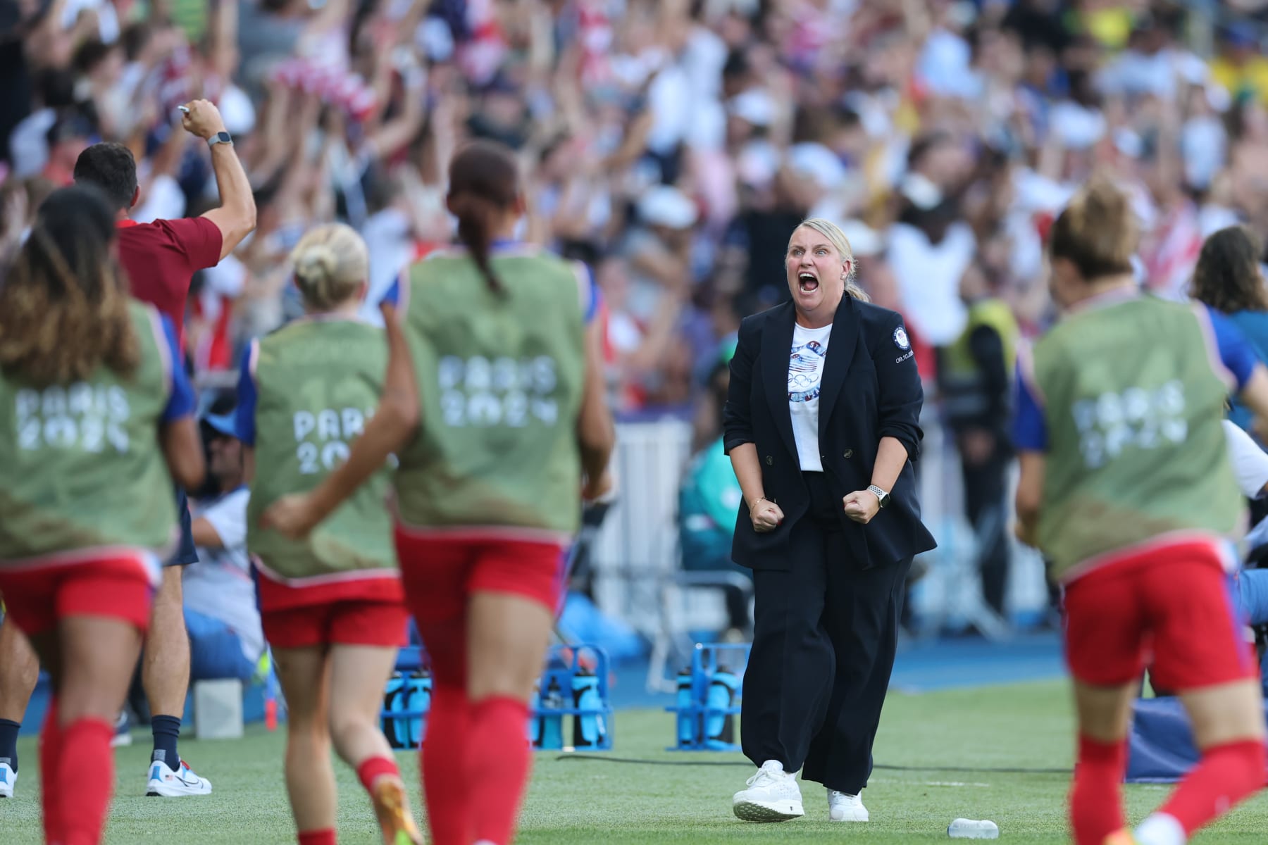 PARIS, FRANCE - AUGUST 10: Emma Hayes, Head Coach of Team United States celebrates after Mallory Swanson #9 of Team United States (not pictured) scores her team's first goal during the Women's Gold Medal match between Brazil and United States of America during the Olympic Games Paris 2024 at Parc des Princes on August 10, 2024 in Paris, France. (Photo by Carl Recine/Getty Images) PARIS, FRANCE - AUGUST 10: Emma Hayes, Head Coach of Team United States celebrates after Mallory Swanson #9 of Team United States (not pictured) scores her team's first goal during the Women's Gold Medal match between Brazil and United States of America during the Olympic Games Paris 2024 at Parc des Princes on August 10, 2024 in Paris, France. (Photo by Carl Recine/Getty Images)