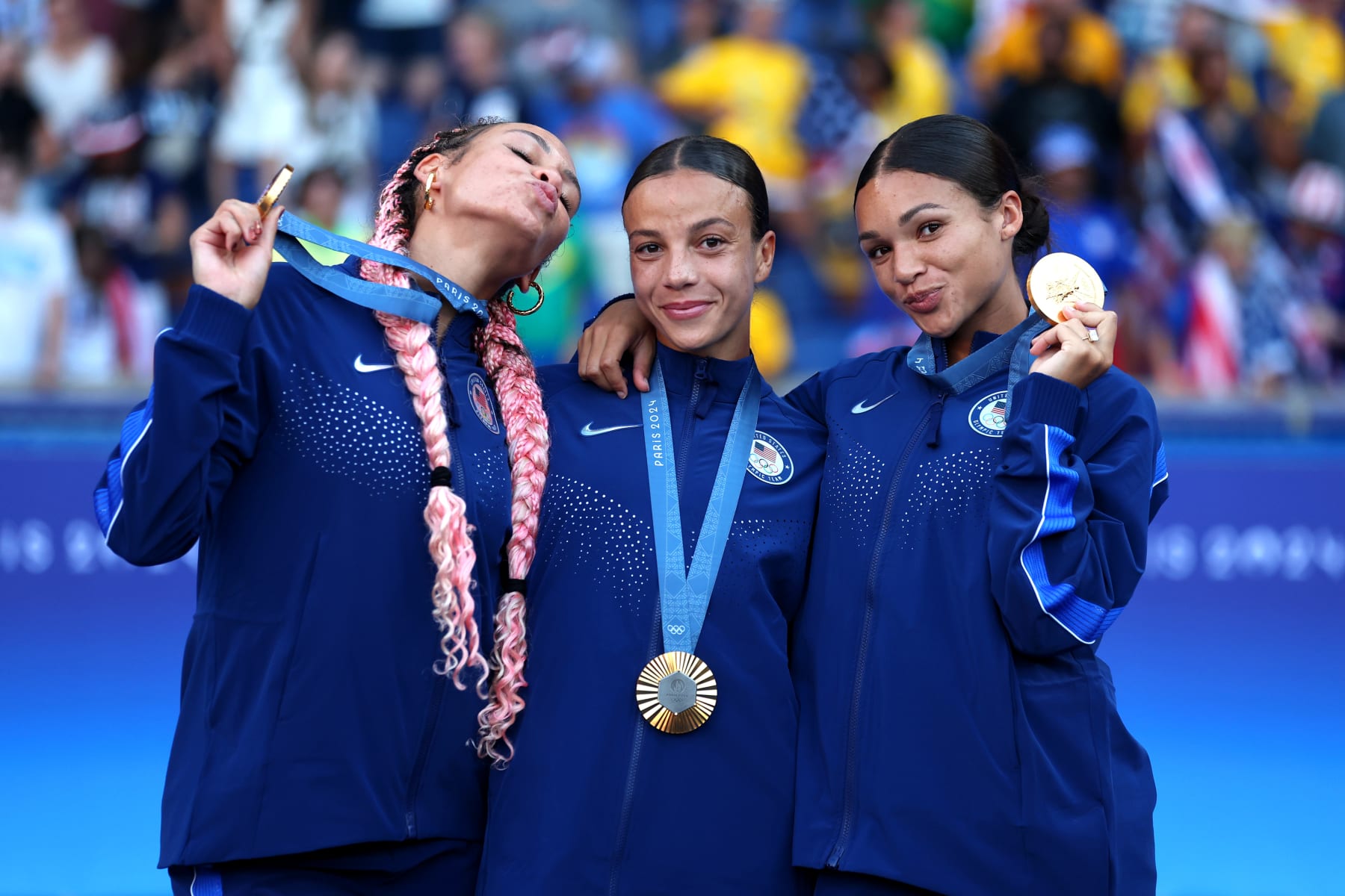 PARIS, FRANCE - AUGUST 10: (L-R) Gold Medalists Trinity Rodman #5, Mallory Swanson #9, Sophia Smith #11 of Team United States pose for a photo with the medals after the Women's Football medal ceremony following the Women's Gold Medal match between Brazil and United States of America during the Olympic Games Paris 2024 at Parc des Princes on August 10, 2024 in Paris, France. (Photo by Carl Recine/Getty Images) PARIS, FRANCE - AUGUST 10: (L-R) Gold Medalists Trinity Rodman #5, Mallory Swanson #9, Sophia Smith #11 of Team United States pose for a photo with the medals after the Women's Football medal ceremony following the Women's Gold Medal match between Brazil and United States of America during the Olympic Games Paris 2024 at Parc des Princes on August 10, 2024 in Paris, France. (Photo by Carl Recine/Getty Images)