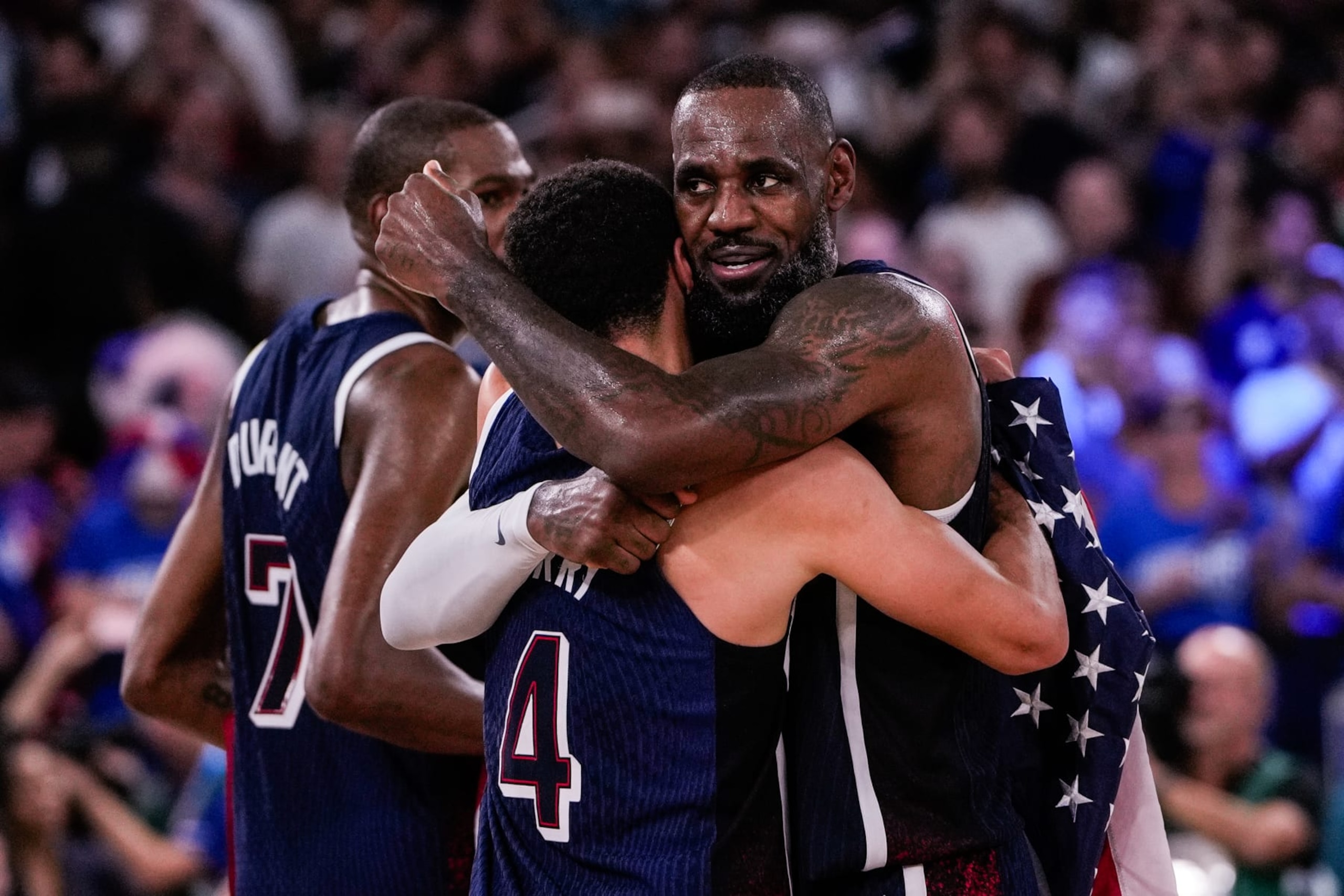PARIS, FRANCE - AUGUST 10: LeBron James of Team United States (R) celebrates winning the gold medal with Stephen Curry of Team United States (L) during the Men's Gold Medal Game, Game 50, match between France and United States on day fifteen of the Olympic Games Paris 2024 at Bercy Arena on August 10, 2024 in Paris, France. (Photo by Jari Pestelacci/Eurasia Sport Images/Getty Images)