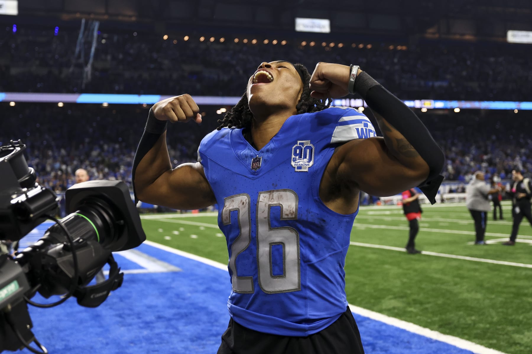 DETROIT, MI - JANUARY 21: Jahmyr Gibbs #26 of the Detroit Lions celebrates while walking to the tunnel after an NFL divisional round playoff football game against the Tampa Bay Buccaneers at Ford Field on January 21, 2024 in Detroit, Michigan. (Photo by Kevin Sabitus/Getty Images)