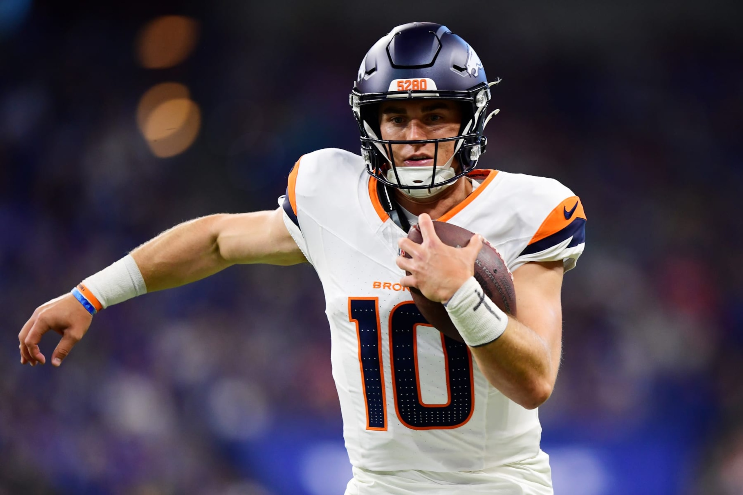 INDIANAPOLIS, INDIANA - AUGUST 11: Bo Nix #10 of the Denver Broncos carries the ball in the first half during a preseason game against the Indianapolis Colts at Lucas Oil Stadium on August 11, 2024 in Indianapolis, Indiana. (Photo by Emilee Chinn/Getty Images) INDIANAPOLIS, INDIANA - AUGUST 11: Bo Nix #10 of the Denver Broncos carries the ball in the first half during a preseason game against the Indianapolis Colts at Lucas Oil Stadium on August 11, 2024 in Indianapolis, Indiana. (Photo by Emilee Chinn/Getty Images)