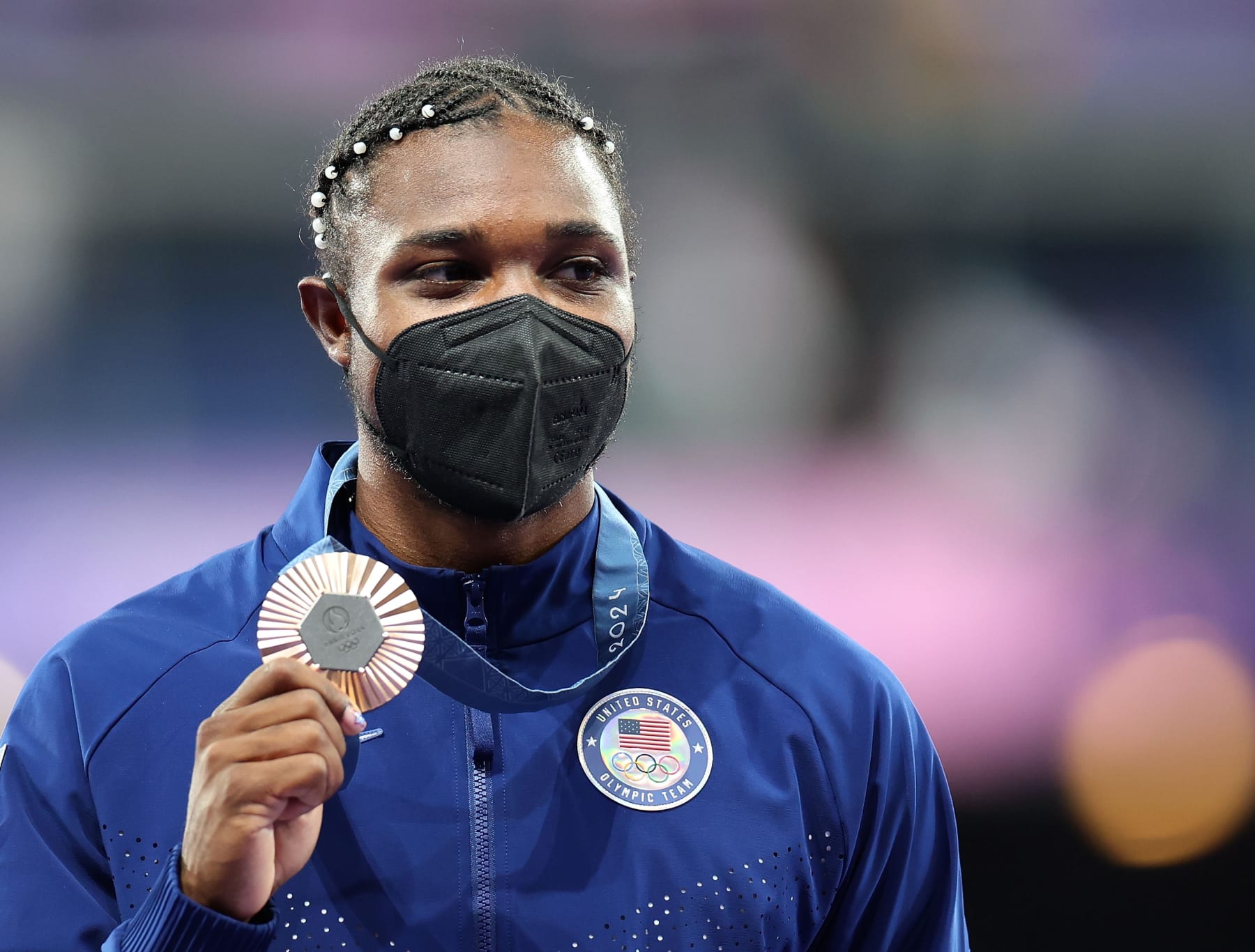 Bronze medalist Noah Lyles of United States reacts during the victory ceremony of the men's 200m of Athletics at the Paris 2024 Olympic Games in Paris, France, Aug. 9, 2024. (Photo by Li Ying/Xinhua via Getty Images)