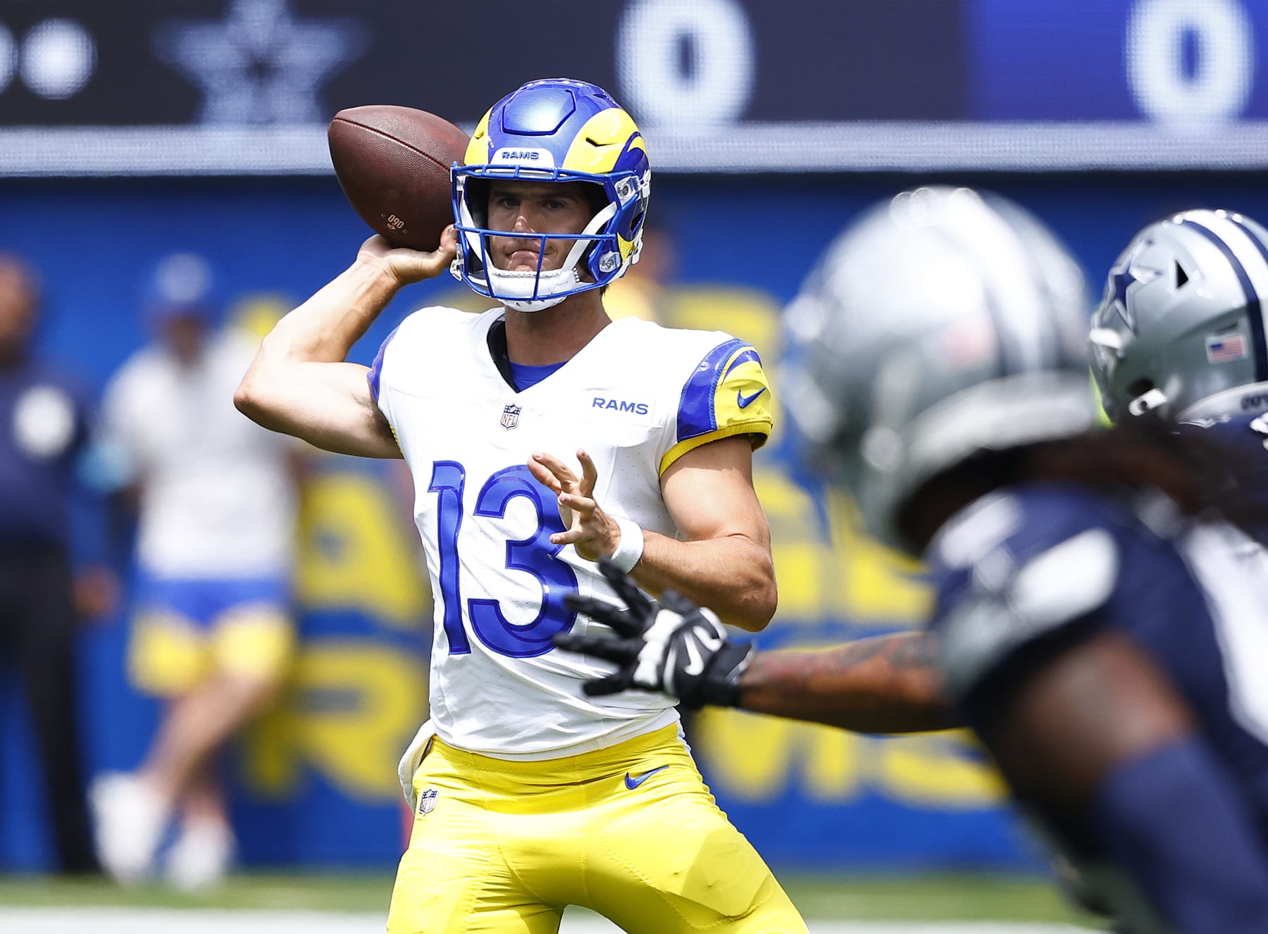 INGLEWOOD, CALIFORNIA - AUGUST 11:  Stetson Bennett #13 of the Los Angeles Rams throws against the Dallas Cowboys in the first half during a preseason game at SoFi Stadium on August 11, 2024 in Inglewood, California. (Photo by Ronald Martinez/Getty Images)