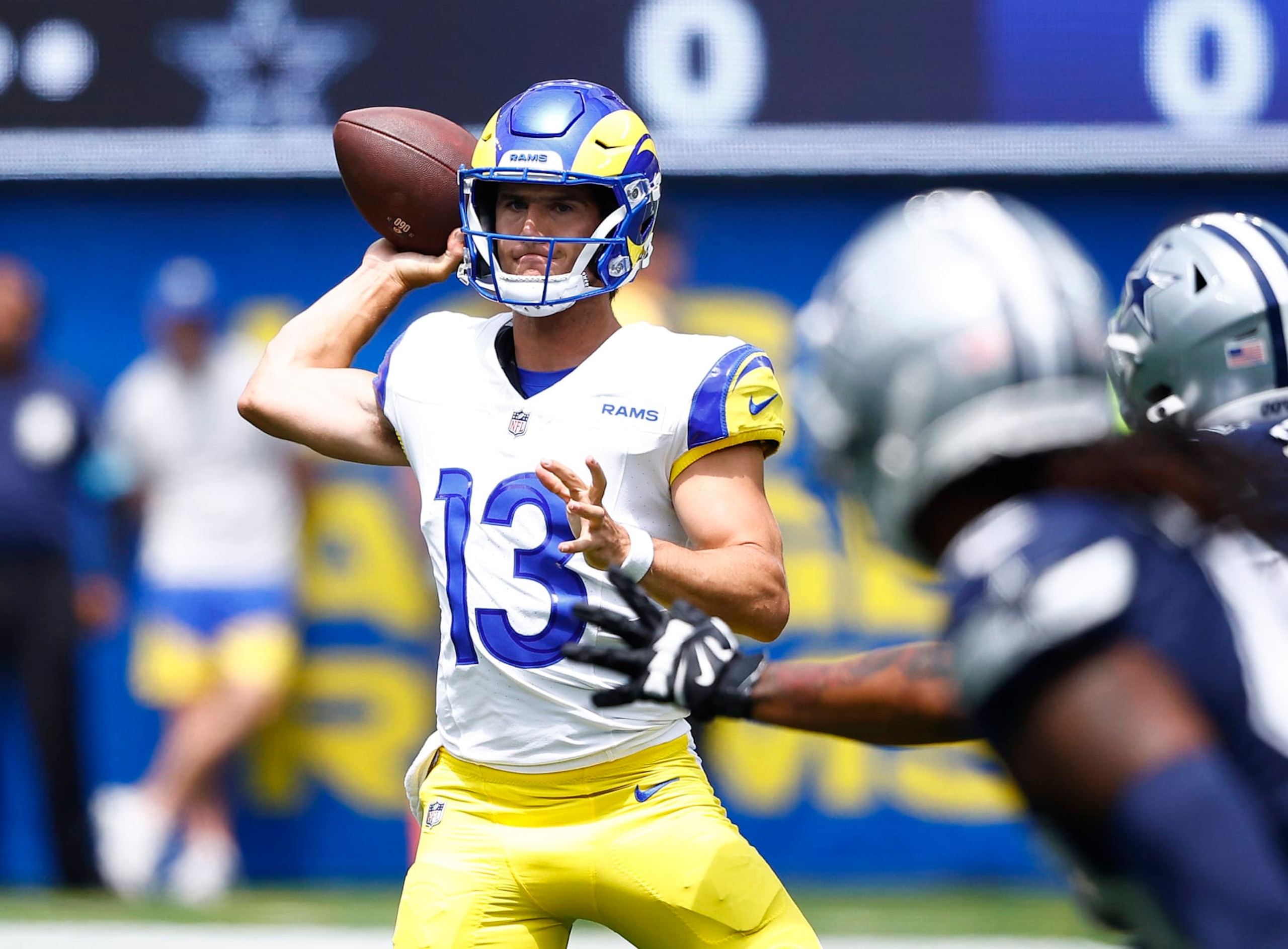 INGLEWOOD, CALIFORNIA - AUGUST 11:  Stetson Bennett #13 of the Los Angeles Rams throws against the Dallas Cowboys in the first half during a preseason game at SoFi Stadium on August 11, 2024 in Inglewood, California. (Photo by Ronald Martinez/Getty Images)