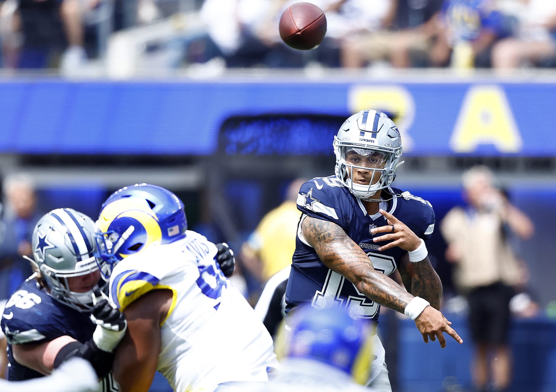 INGLEWOOD, CALIFORNIA - AUGUST 11:  Trey Lance #19 of the Dallas Cowboys throws against the Los Angeles Rams in the first half during a preseason game at SoFi Stadium on August 11, 2024 in Inglewood, California. (Photo by Ronald Martinez/Getty Images)