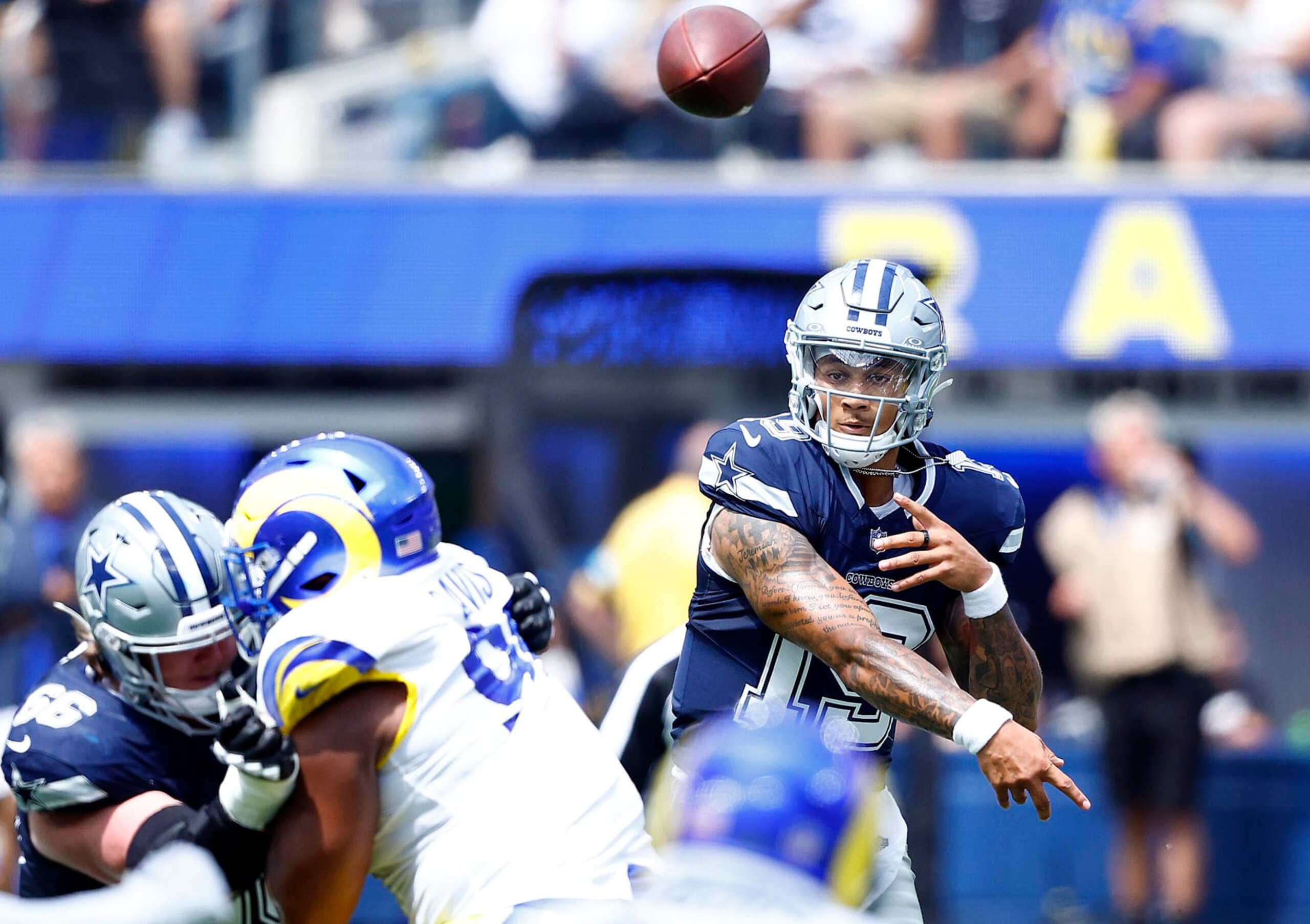 INGLEWOOD, CALIFORNIA - AUGUST 11:  Trey Lance #19 of the Dallas Cowboys throws against the Los Angeles Rams in the first half during a preseason game at SoFi Stadium on August 11, 2024 in Inglewood, California. (Photo by Ronald Martinez/Getty Images)