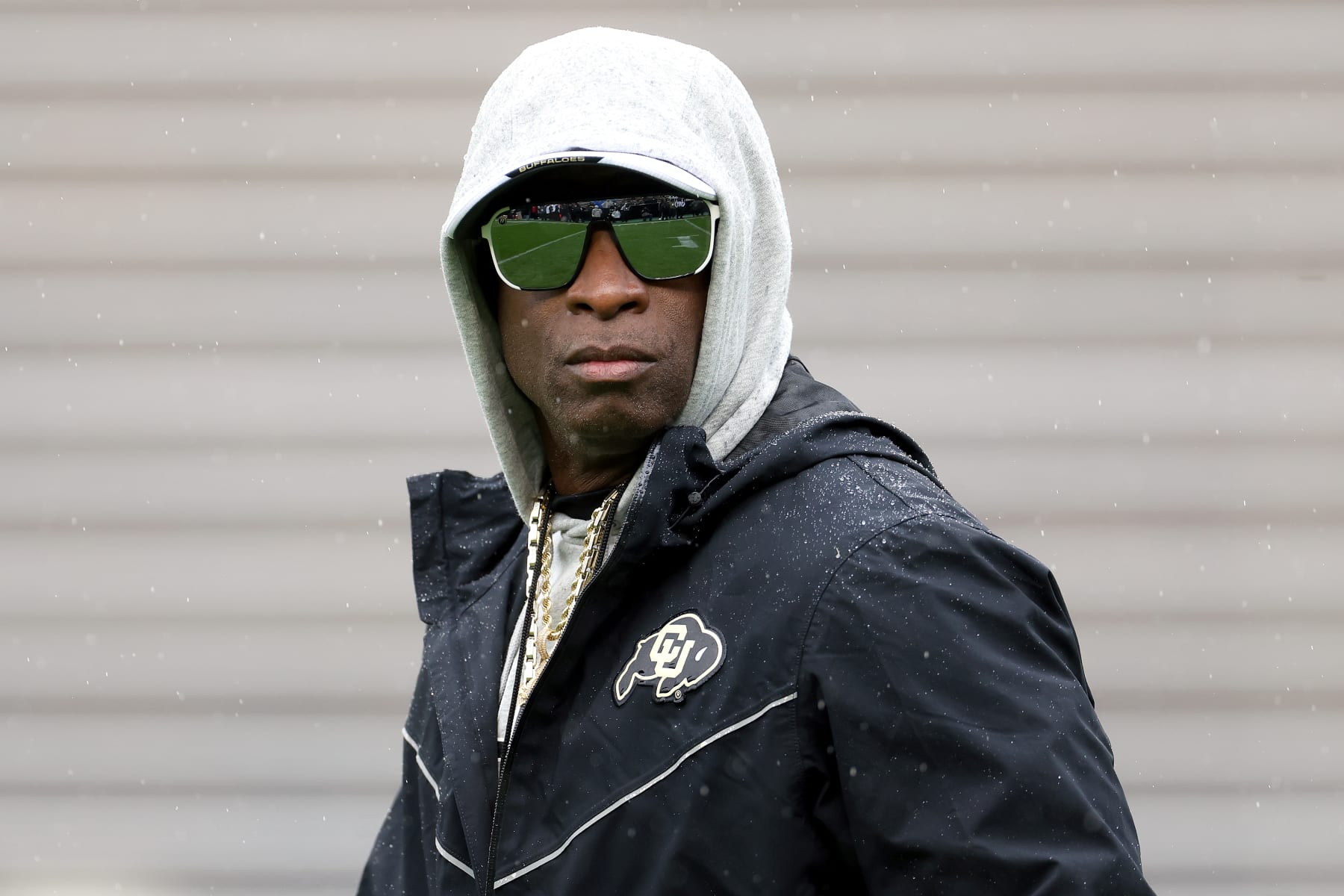 BOULDER, COLORADO - APRIL 27: Head coach Deion Sanders of the Colorado Buffaloes watches as his team warms-up prior to their spring game at Folsom Field on April 27, 2024 in Boulder, Colorado.  (Photo by Matthew Stockman/Getty Images)
