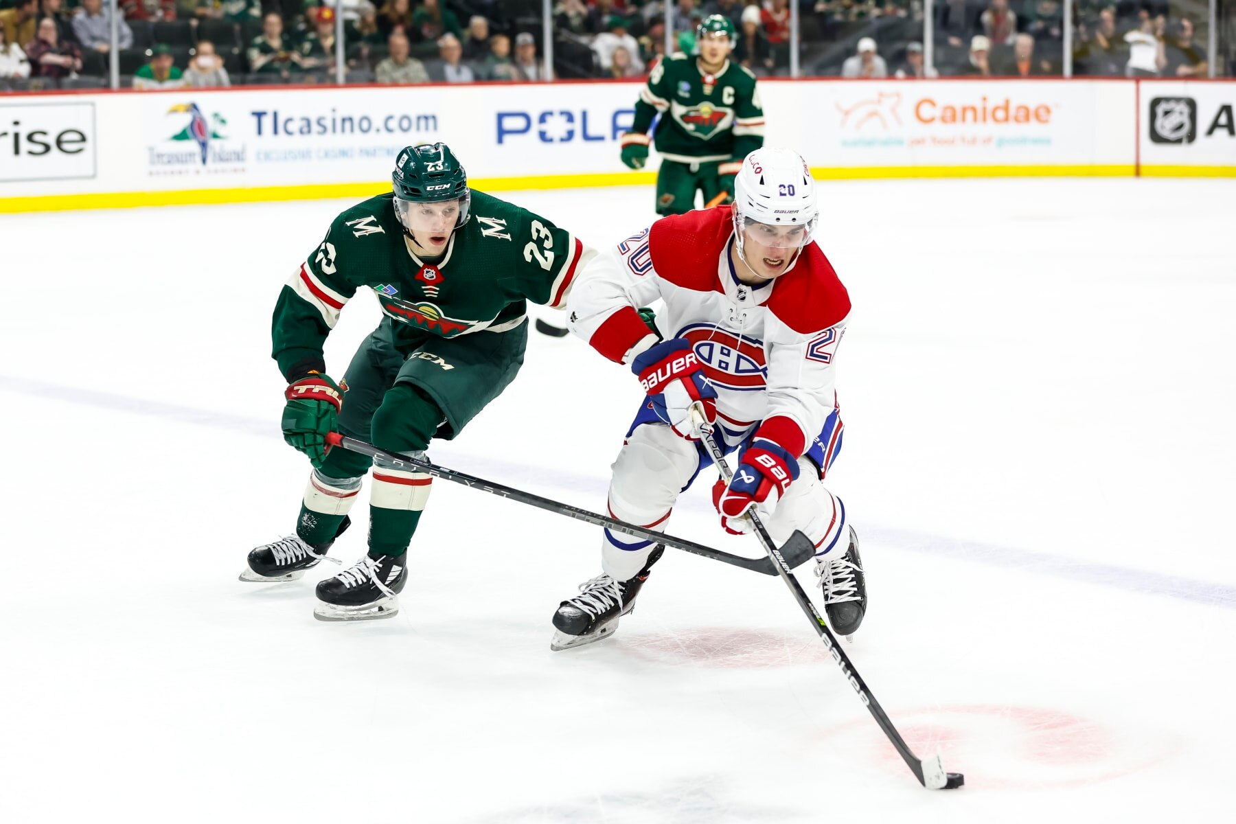 Minnesota Wild forward Marco Rossi (left) and Montreal Canadiens winger Juraj Slafkovský.