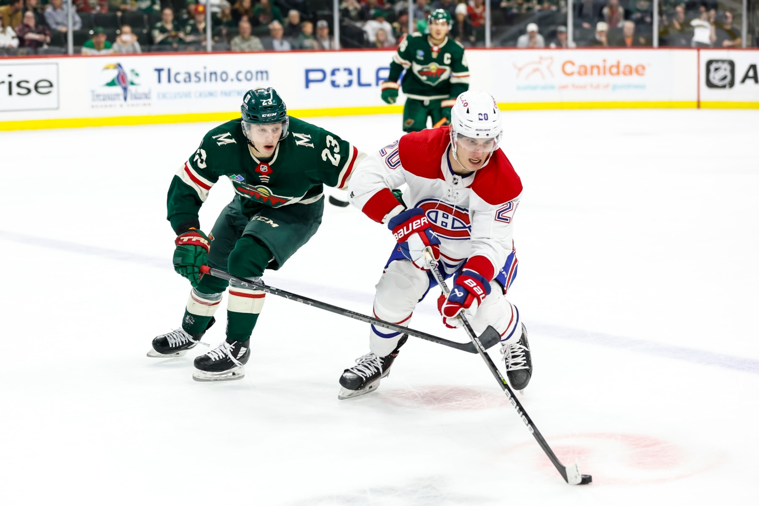 Minnesota Wild forward Marco Rossi (left) and Montreal Canadiens winger Juraj Slafkovský.