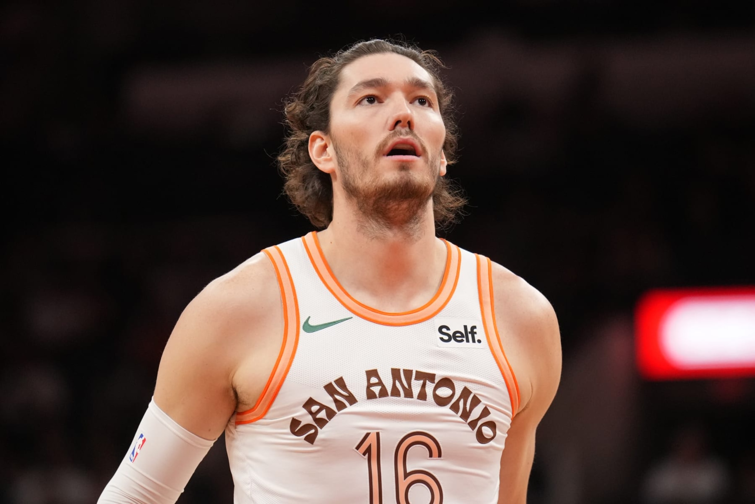 SAN ANTONIO, TX - MARCH 25: Cedi Osman #16 of the San Antonio Spurs looks on during the game against the Phoenix Suns on March 25, 2024 at the AT&T Center in San Antonio, Texas. NOTE TO USER: User expressly acknowledges and agrees that, by downloading and or using this photograph, user is consenting to the terms and conditions of the Getty Images License Agreement. Mandatory Copyright Notice: Copyright 2024 NBAE (Photos by Jesse D. Garrabrant/NBAE via Getty Images)