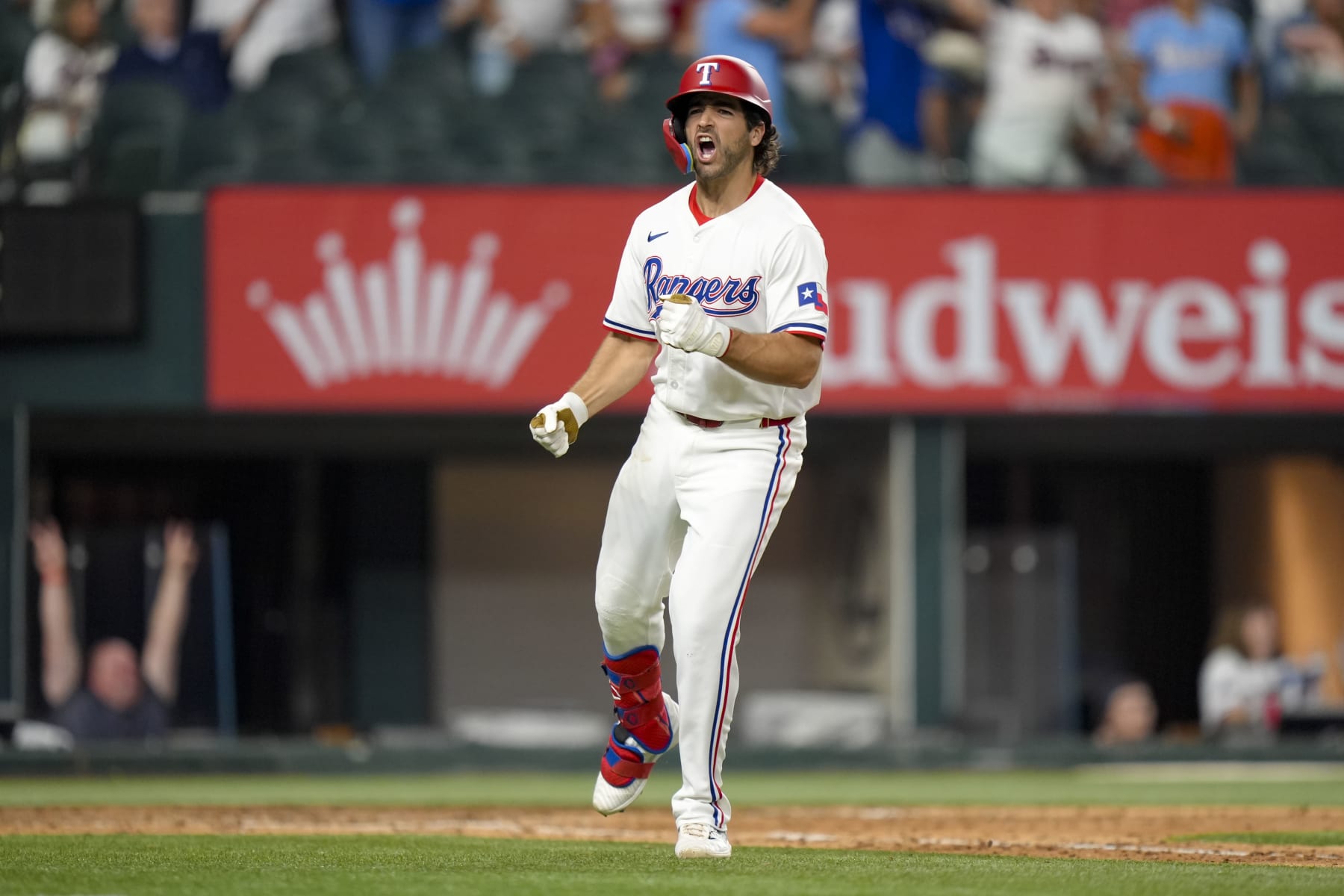ARLINGTON, TX - AUGUST 06: Josh Smith #8 of the Texas Rangers reacts after hitting a walk-off two-run home run in the 10th inning during a game against the Houston Astros at Globe Life Field on August 06, 2024 in Arlington, Texas. The Texas Rangers won 4-3. (Photo by Kate Woolson/Texas Rangers/Getty Images)