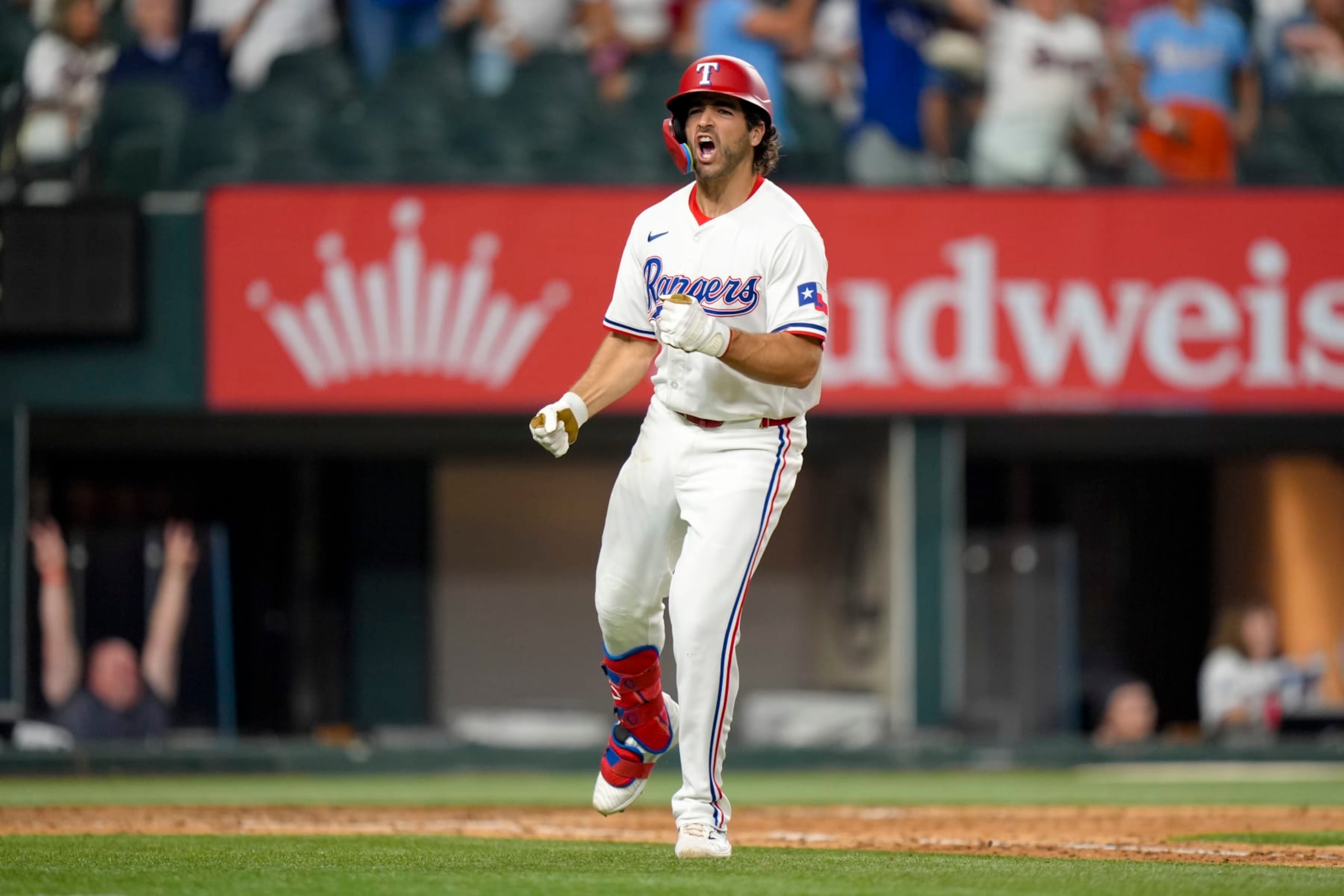 ARLINGTON, TX - AUGUST 06: Josh Smith #8 of the Texas Rangers reacts after hitting a walk-off two-run home run in the 10th inning during a game against the Houston Astros at Globe Life Field on August 06, 2024 in Arlington, Texas. The Texas Rangers won 4-3. (Photo by Kate Woolson/Texas Rangers/Getty Images)
