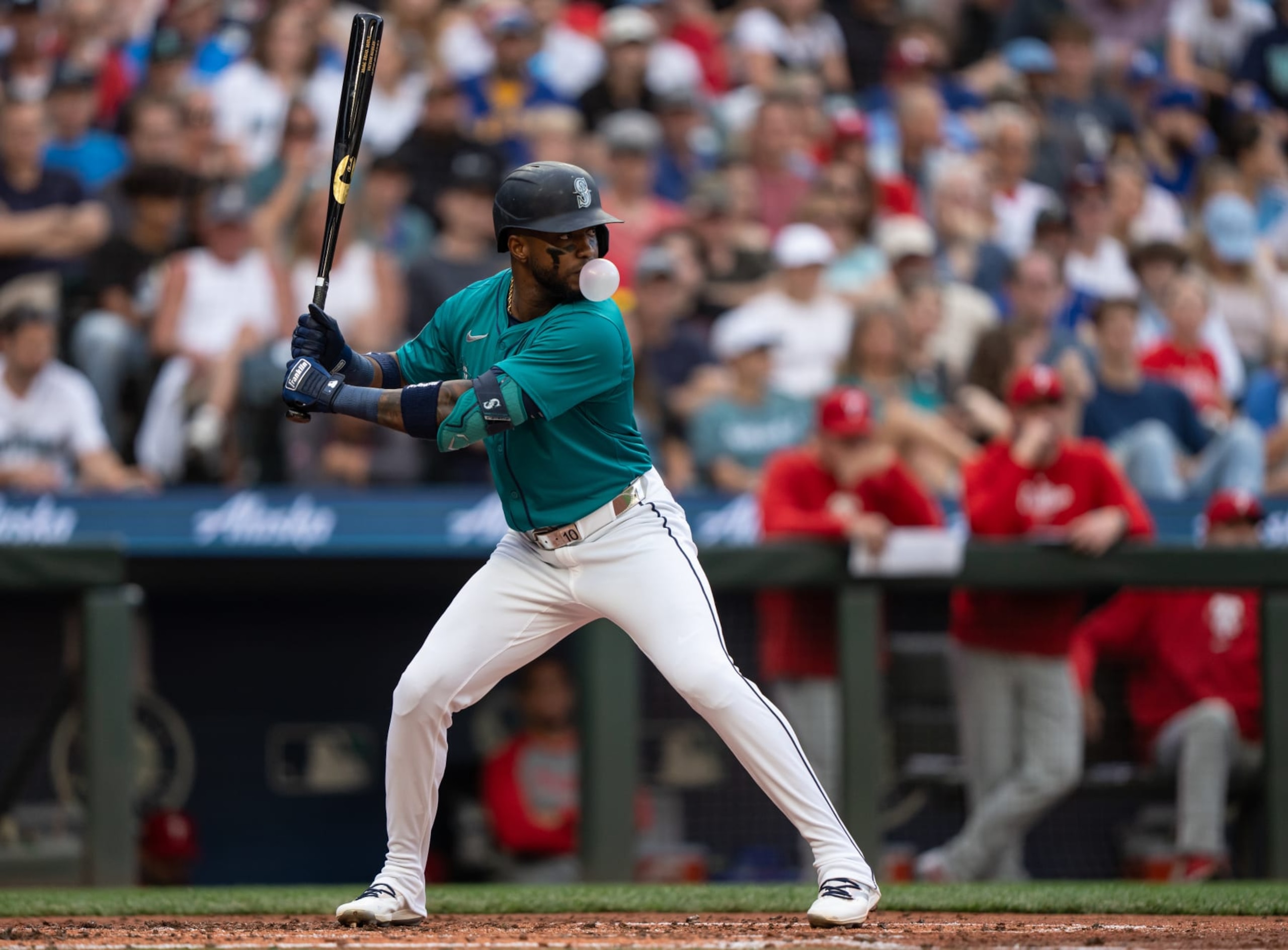 SEATTLE, WA - AUGUST 03: Victor Robles #10 of the Seattle Mariners blows a bubble while waiting for a pitch during an at-bat in a game against the Philadelphia Phillies at T-Mobile Park on August 3, 2024 in Seattle, Washington. The Mariners won 6-5 in ten innings. (Photo by Stephen Brashear/Getty Images)