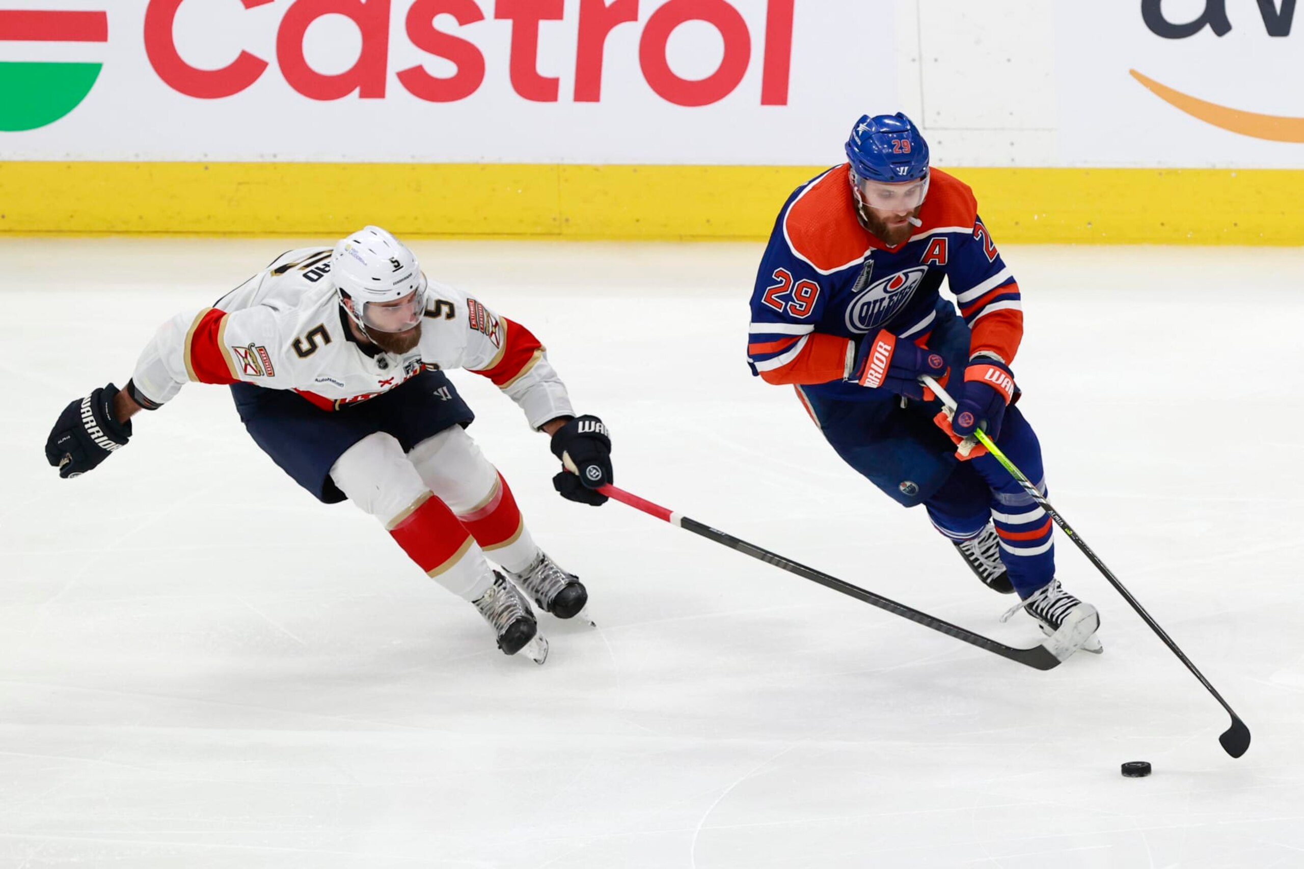 EDMONTON, ALBERTA - JUNE 21: Leon Draisaitl #29 of the Edmonton Oilers skates past Aaron Ekblad #5 of the Florida Panthers during the second period of Game Six of the 2024 Stanley Cup Final at Rogers Place on June 21, 2024 in Edmonton, Alberta.  (Photo by Jeff Vinnick/Getty Images)