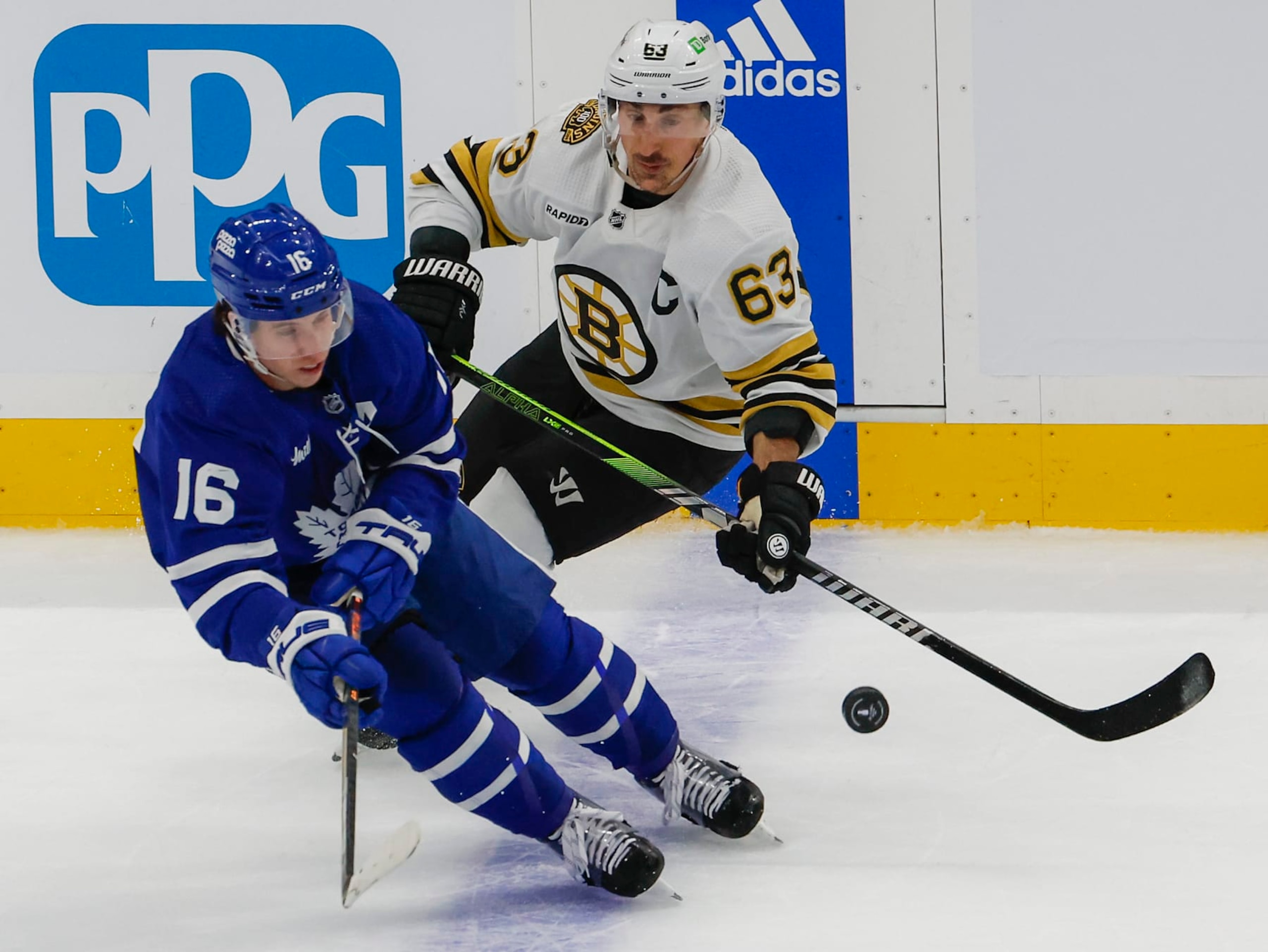 Toronto, ON - April 27: Boston Bruins left wing Brad Marchand and Toronto Maple Leafs right wing Mitchell Marner in the first period. (Photo by Matthew J. Lee/The Boston Globe via Getty Images)