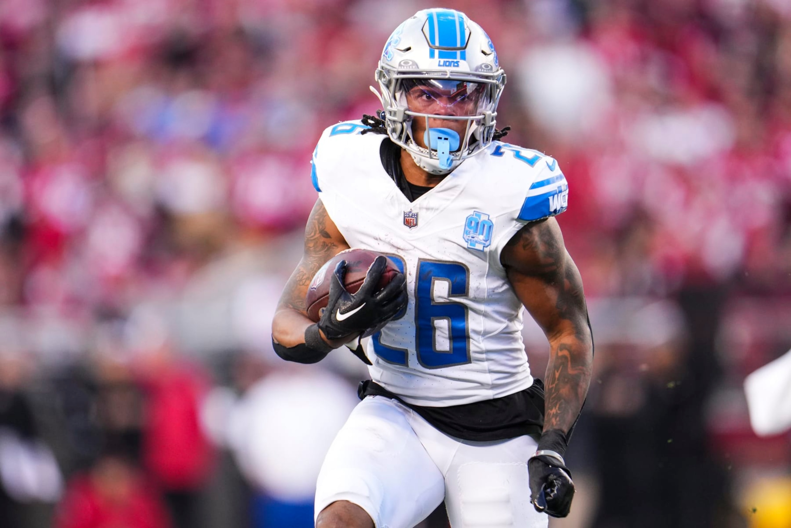 SANTA CLARA, CA - JANUARY 28: Jahmyr Gibbs #26 of the Detroit Lions runs the ball during the NFC Championship NFL football game against the San Francisco 49ers at Levi's Stadium on January 28, 2024 in Santa Clara, California. (Photo by Cooper Neill/Getty Images)