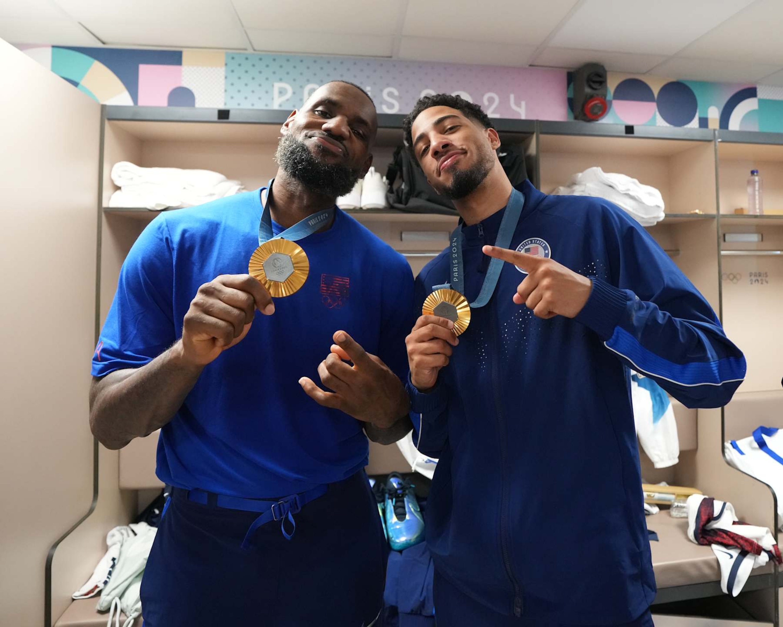 PARIS, FRANCE - AUGUST 10: LeBron James #6 and Tyrese Haliburton #9 of Team USA pose for a photo after winning the Men's Gold Medal Game on August 10, 2024 at the AccorHotels Arena in Paris, France. NOTE TO USER: User expressly acknowledges and agrees that, by downloading and/or using this photograph, user is consenting to the terms and conditions of the Getty Images License Agreement. Mandatory Copyright Notice: Copyright 2024 NBAE (Photo by Jesse D. Garrabrant/NBAE via Getty Images)