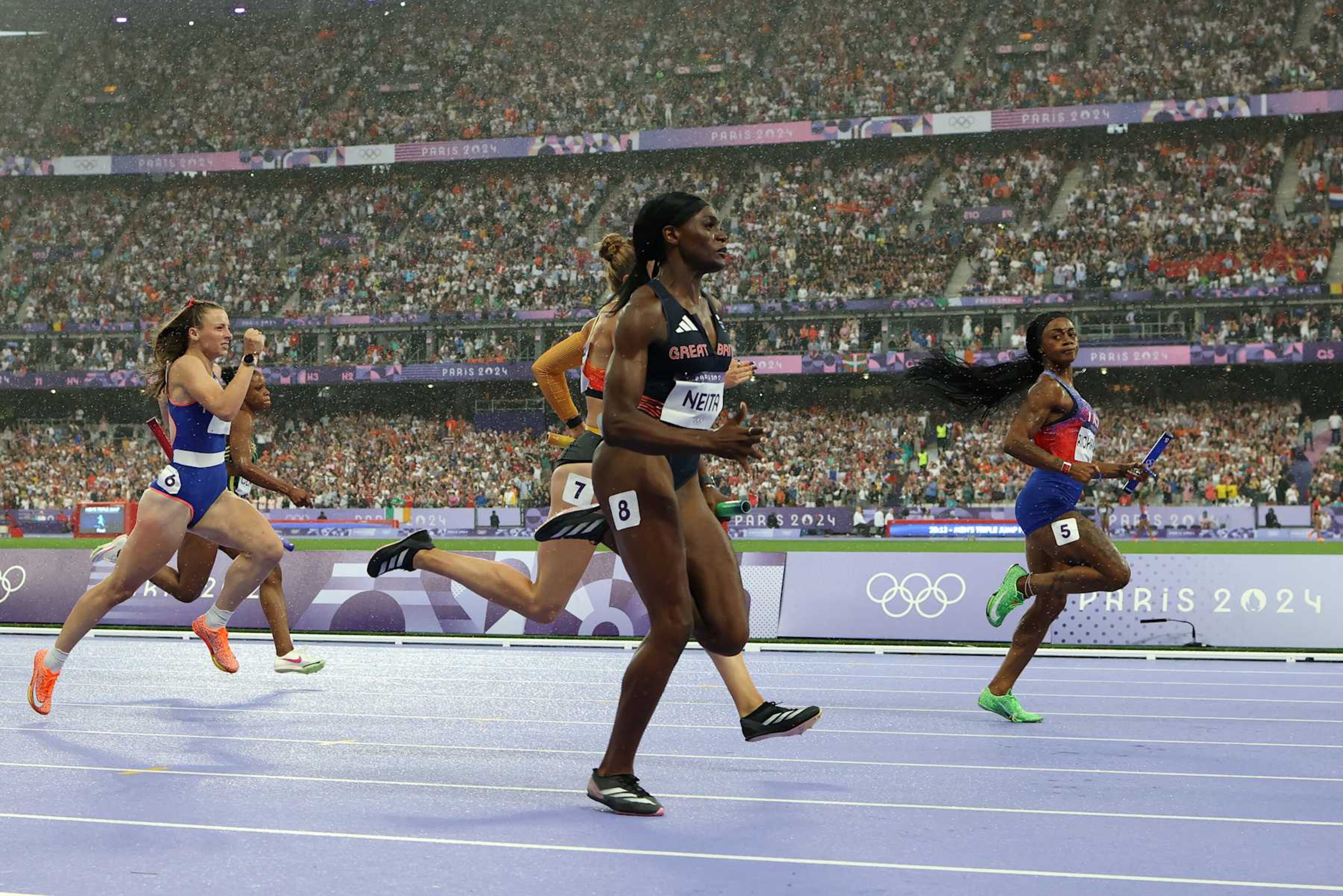PARIS, FRANCE - AUGUST 09: Sha'carri Richardson looks across to Daryll Neita of Team Great Britain before she accelerates to the line to win the Women's 4 x 100m Relay Final for the USA on day fourteen of the Olympic Games Paris 2024 at Stade de France on August 09, 2024 in Paris, France. (Photo by Richard Heathcote/Getty Images) PARIS, FRANCE - AUGUST 09: Sha'carri Richardson looks across to Daryll Neita of Team Great Britain before she accelerates to the line to win the Women's 4 x 100m Relay Final for the USA on day fourteen of the Olympic Games Paris 2024 at Stade de France on August 09, 2024 in Paris, France. (Photo by Richard Heathcote/Getty Images)