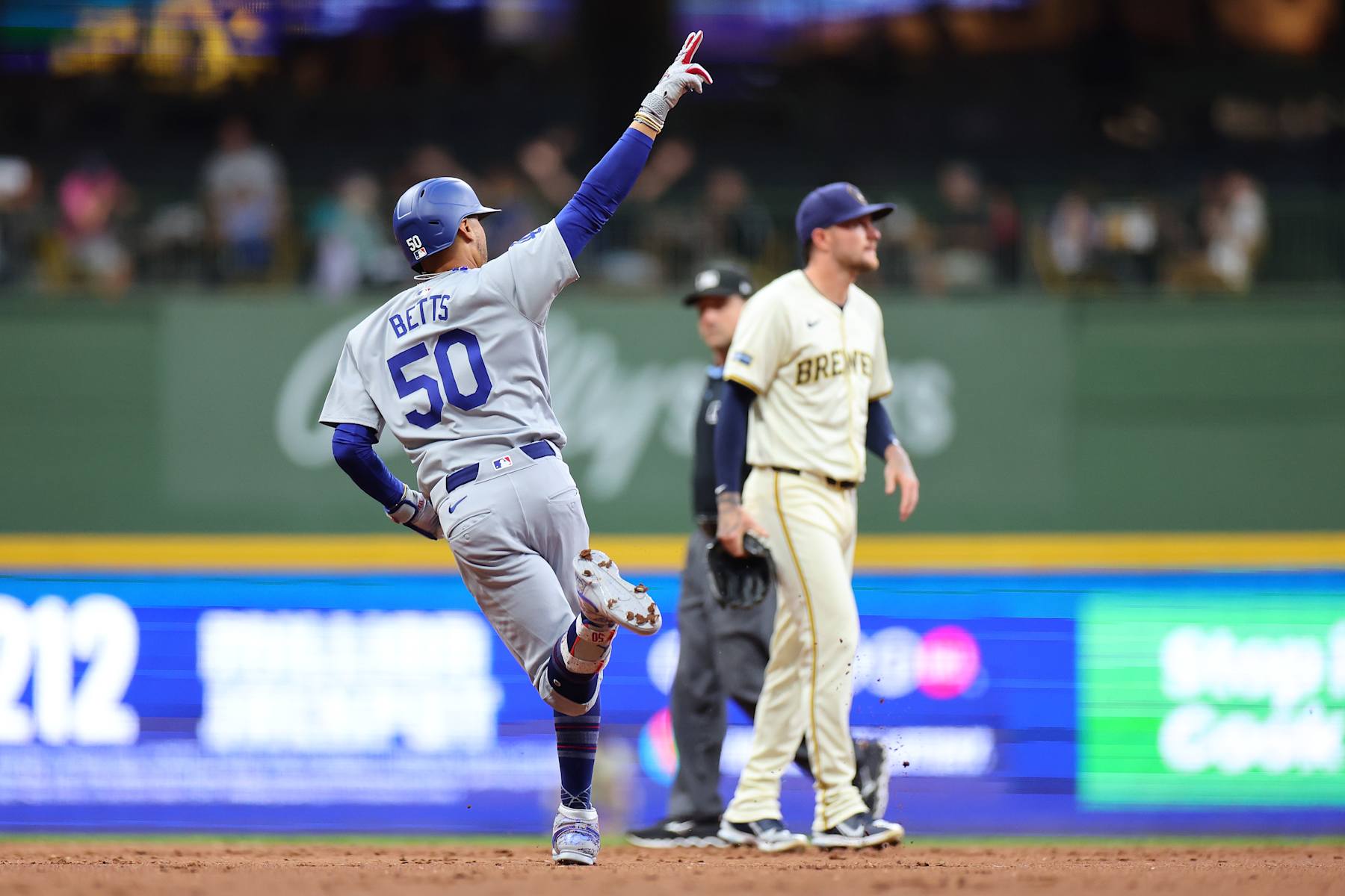 MILWAUKEE, WISCONSIN - AUGUST 12: Mookie Betts #50 of the Los Angeles Dodgers runs the bases following a two run home run against the Milwaukee Brewers during the third inning at American Family Field on August 12, 2024 in Milwaukee, Wisconsin. (Photo by Stacy Revere/Getty Images)