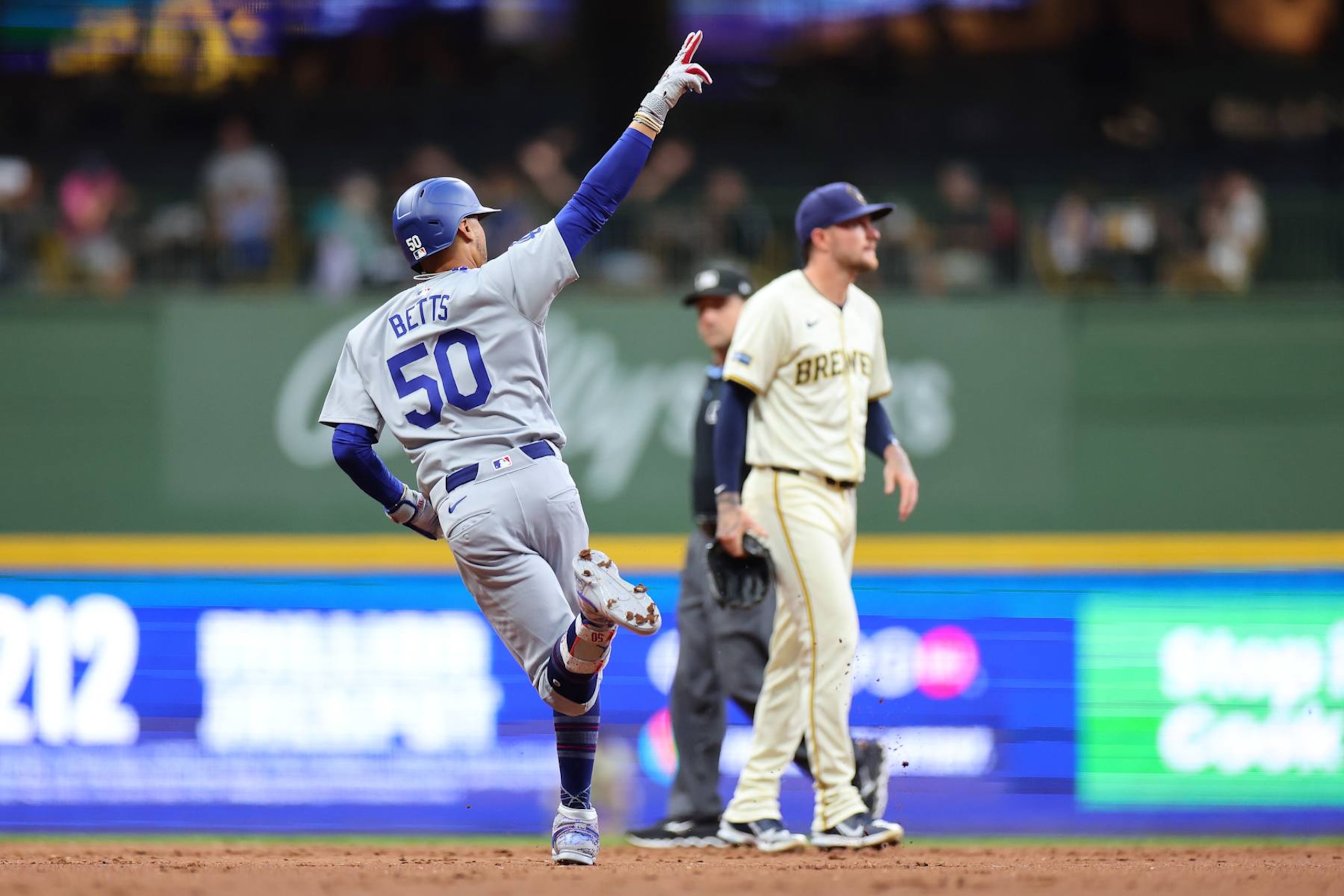 MILWAUKEE, WISCONSIN - AUGUST 12: Mookie Betts #50 of the Los Angeles Dodgers runs the bases following a two run home run against the Milwaukee Brewers during the third inning at American Family Field on August 12, 2024 in Milwaukee, Wisconsin. (Photo by Stacy Revere/Getty Images)