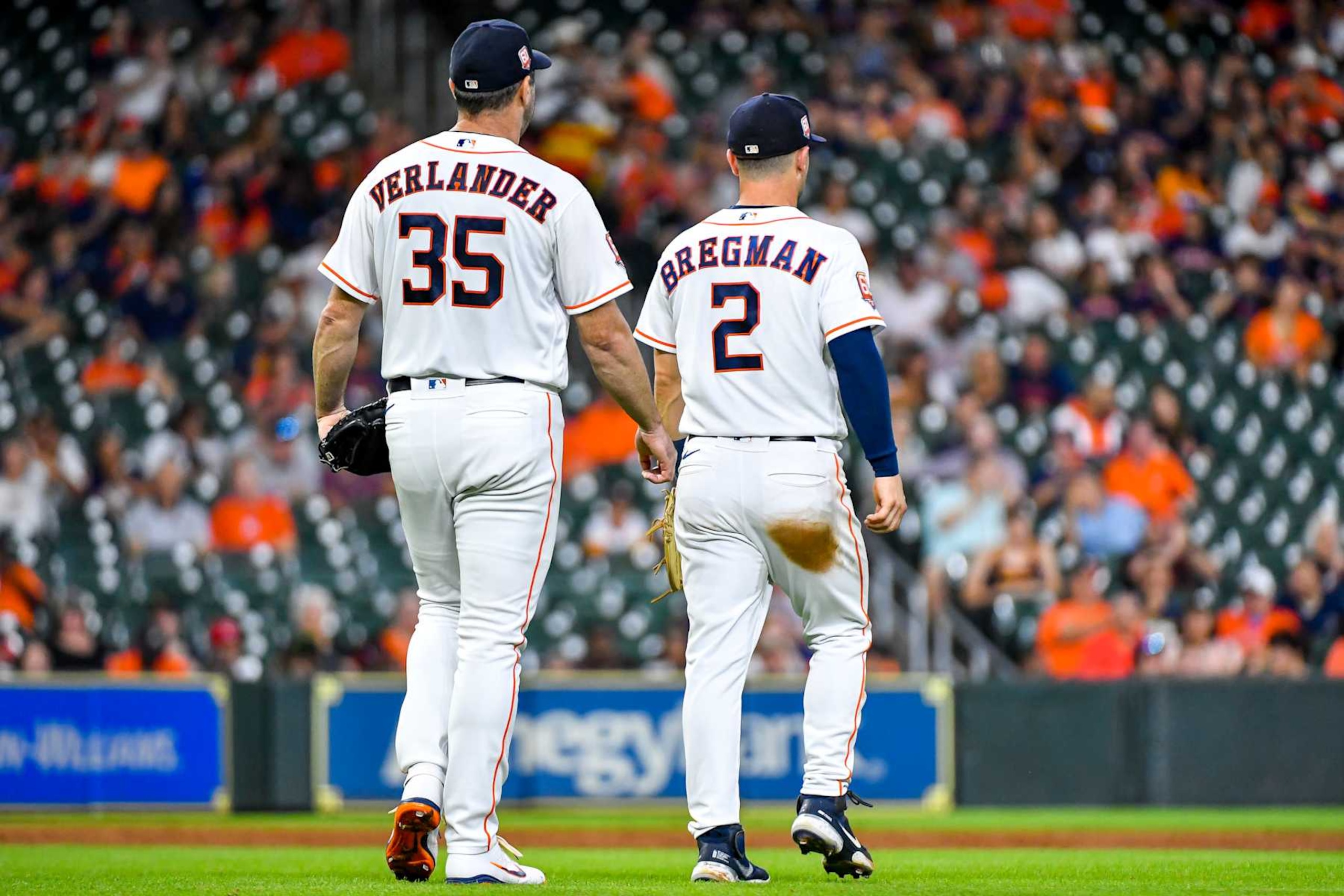 HOUSTON, TEXAS - AUGUST 10: Justin Verlander #35 walks with Alex Bregman #2 of the Houston Astros pitches against the Texas Rangers at Minute Maid Park on August 10, 2022 in Houston, Texas. (Photo by Logan Riely/Getty Images)
