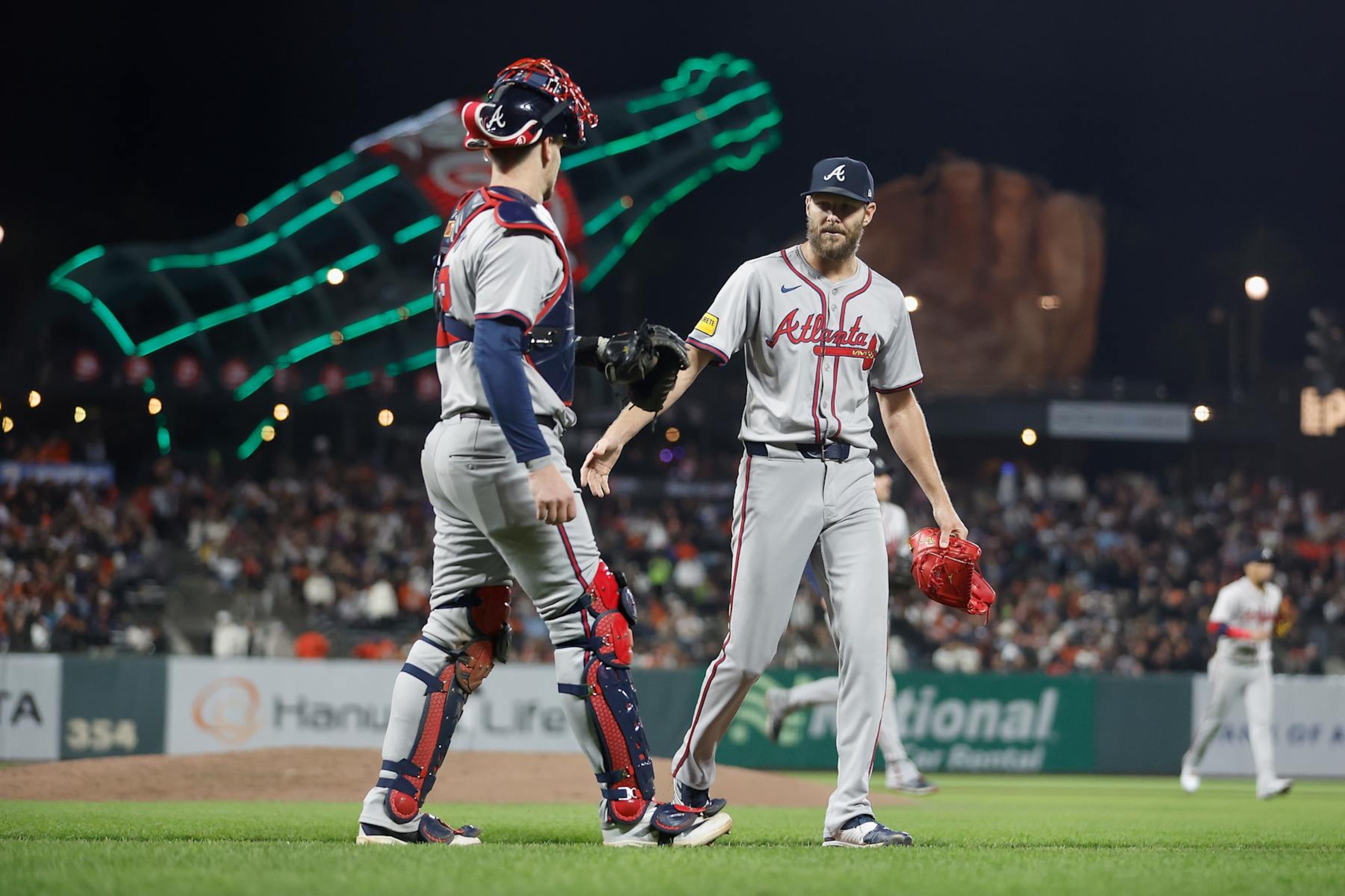 SAN FRANCISCO, CALIFORNIA - AUGUST 12: Pitcher Chris Sale #51 of the Atlanta Braves talks to catcher Sean Murphy #12 after pitching in the bottom of the seventh inning against the San Francisco Giants at Oracle Park on August 12, 2024 in San Francisco, California. (Photo by Lachlan Cunningham/Getty Images)