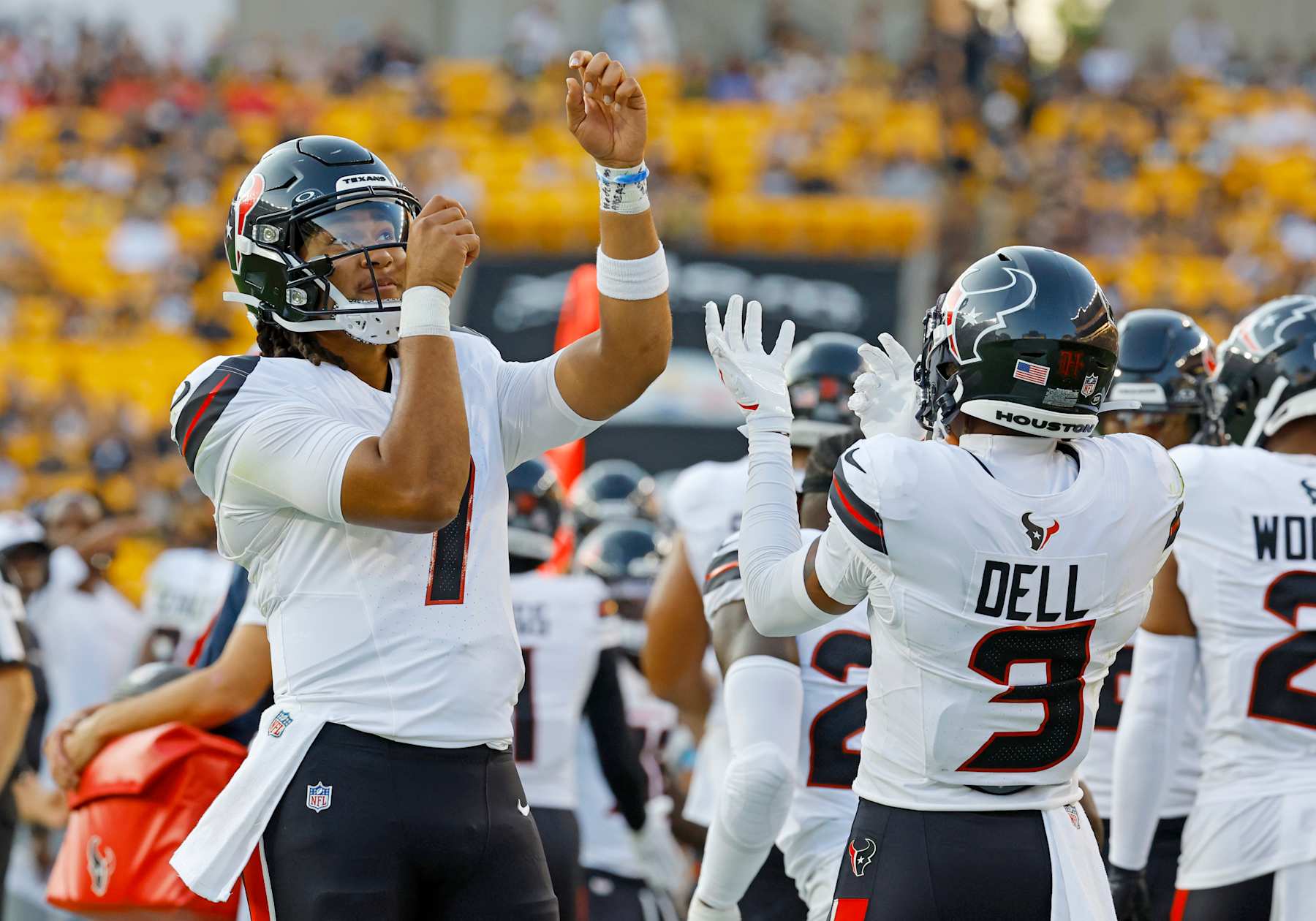 Texans QB C.J. Stroud (left) and WR Tank Dell (right)