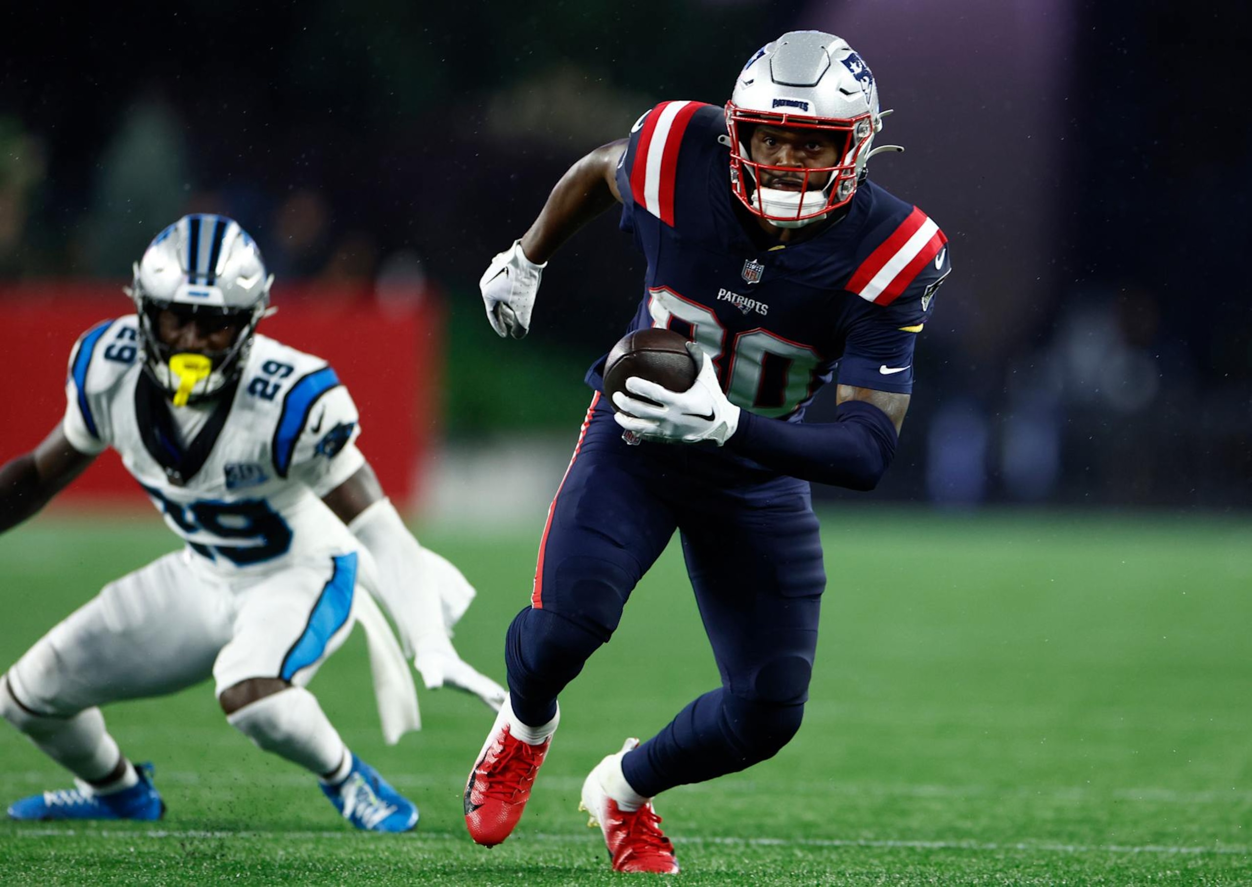 Foxborough, MA - August 8: New England Patriots WR Kayshon Boutte makes a catch over Carolina Panthers CB D'Shawn Jamison in the first half of a preseason game at Gillette Stadium. (Photo by Danielle Parhizkaran/The Boston Globe via Getty Images)
