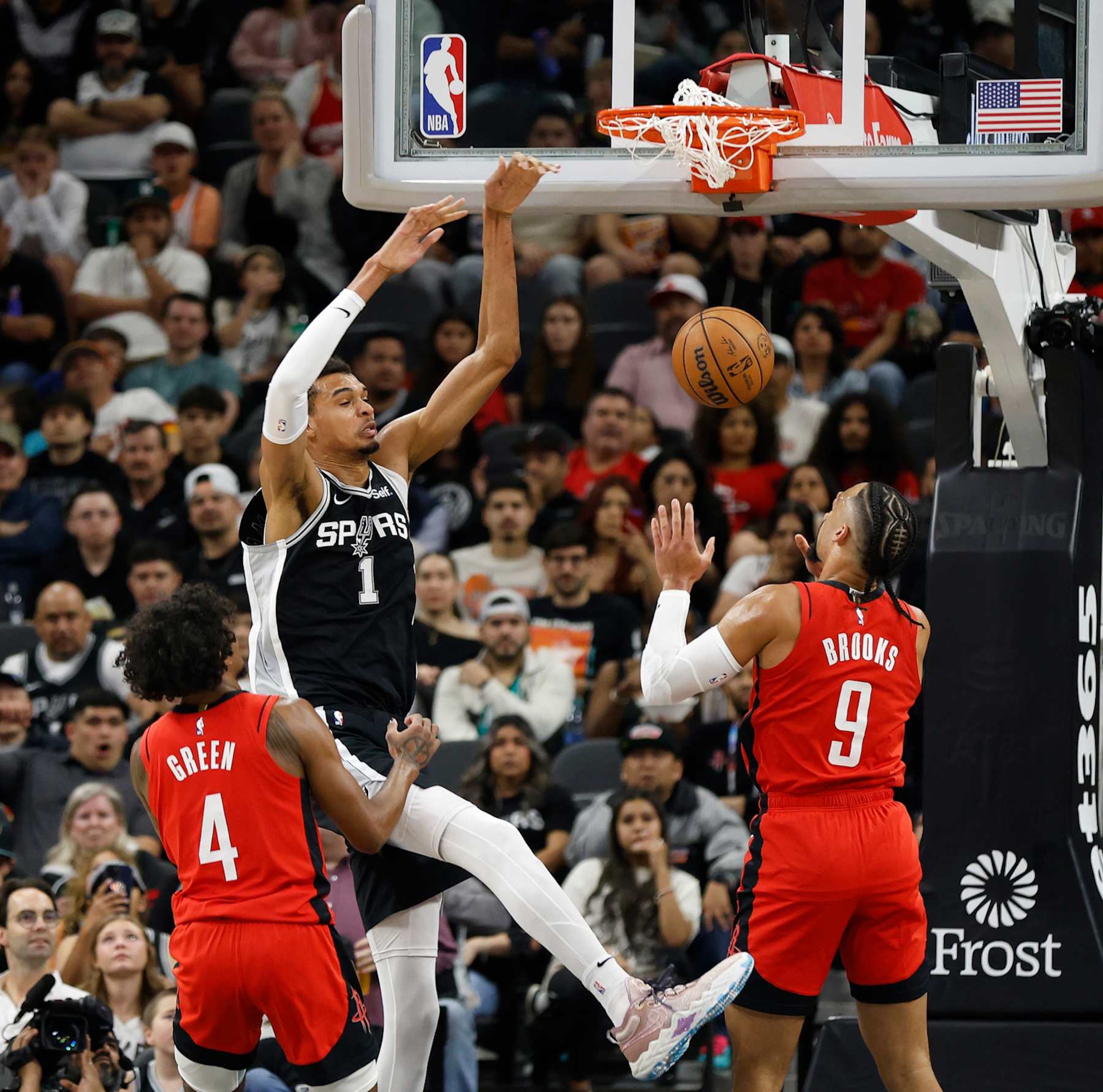 SAN ANTONIO, TX - MARCH 12: Victor Wembanyama #1 of the San Antonio Spurs dunks over Dillon Brooks #9 of the Houston Rockets in the first half at Frost Bank Center on March 12, 2024 in San Antonio, Texas. NOTE TO USER: User expressly acknowledges and agrees that, by downloading and or using this photograph, User is consenting to terms and conditions of the Getty Images License Agreement. (Photo by Ronald Cortes/Getty Images) SAN ANTONIO, TX - MARCH 12: Victor Wembanyama #1 of the San Antonio Spurs dunks over Dillon Brooks #9 of the Houston Rockets in the first half at Frost Bank Center on March 12, 2024 in San Antonio, Texas. NOTE TO USER: User expressly acknowledges and agrees that, by downloading and or using this photograph, User is consenting to terms and conditions of the Getty Images License Agreement. (Photo by Ronald Cortes/Getty Images)