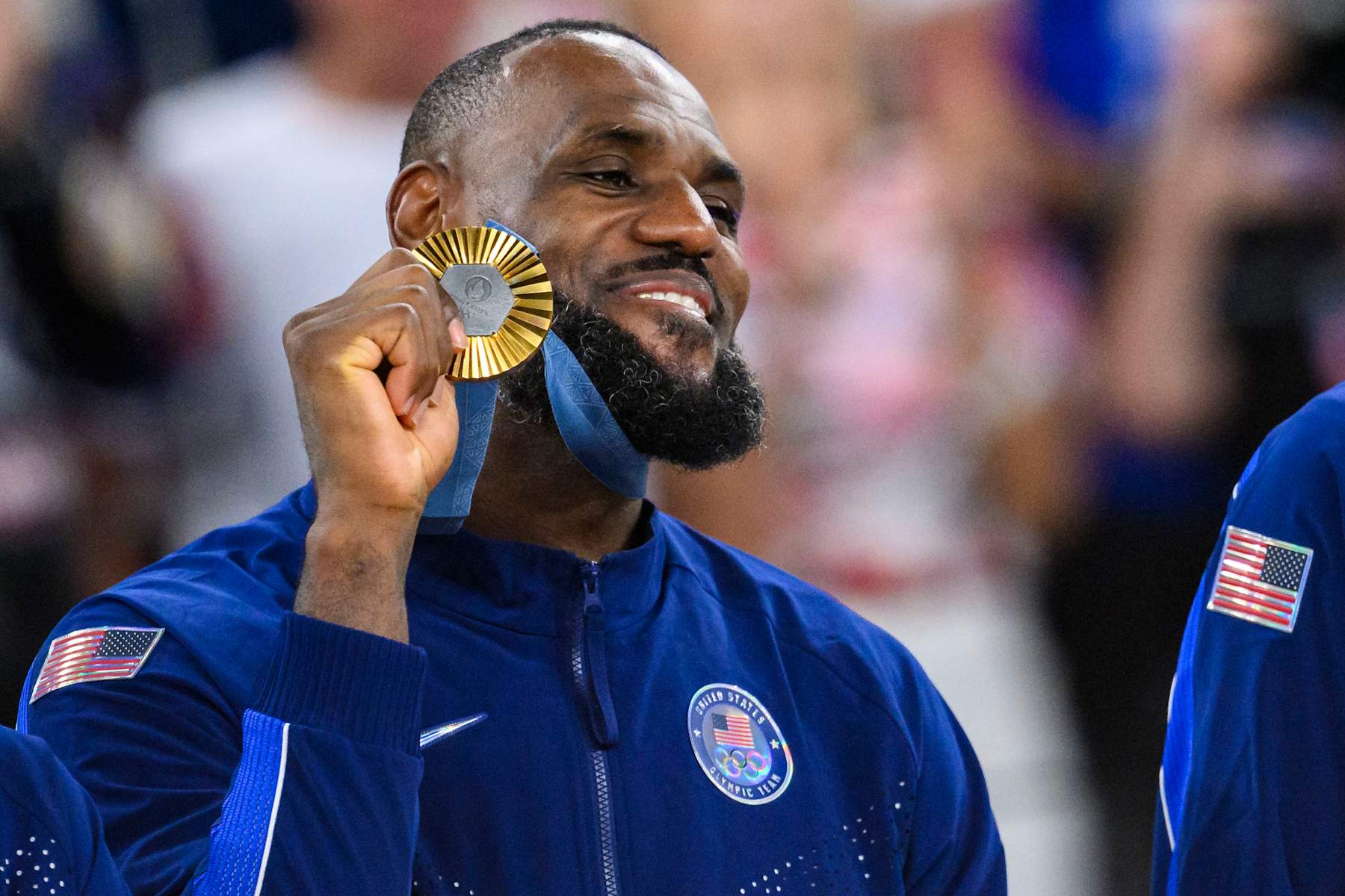 PARIS, FRANCE - AUGUST 11: Gold medalist LeBron James of Team United States celebrate on the podium during the Men's basketball medal ceremony on day fifteen of the Olympic Games Paris 2024 at the Bercy Arena on August 11, 2024 in Paris, France. (Photo by Tom Weller/VOIGT/GettyImages)