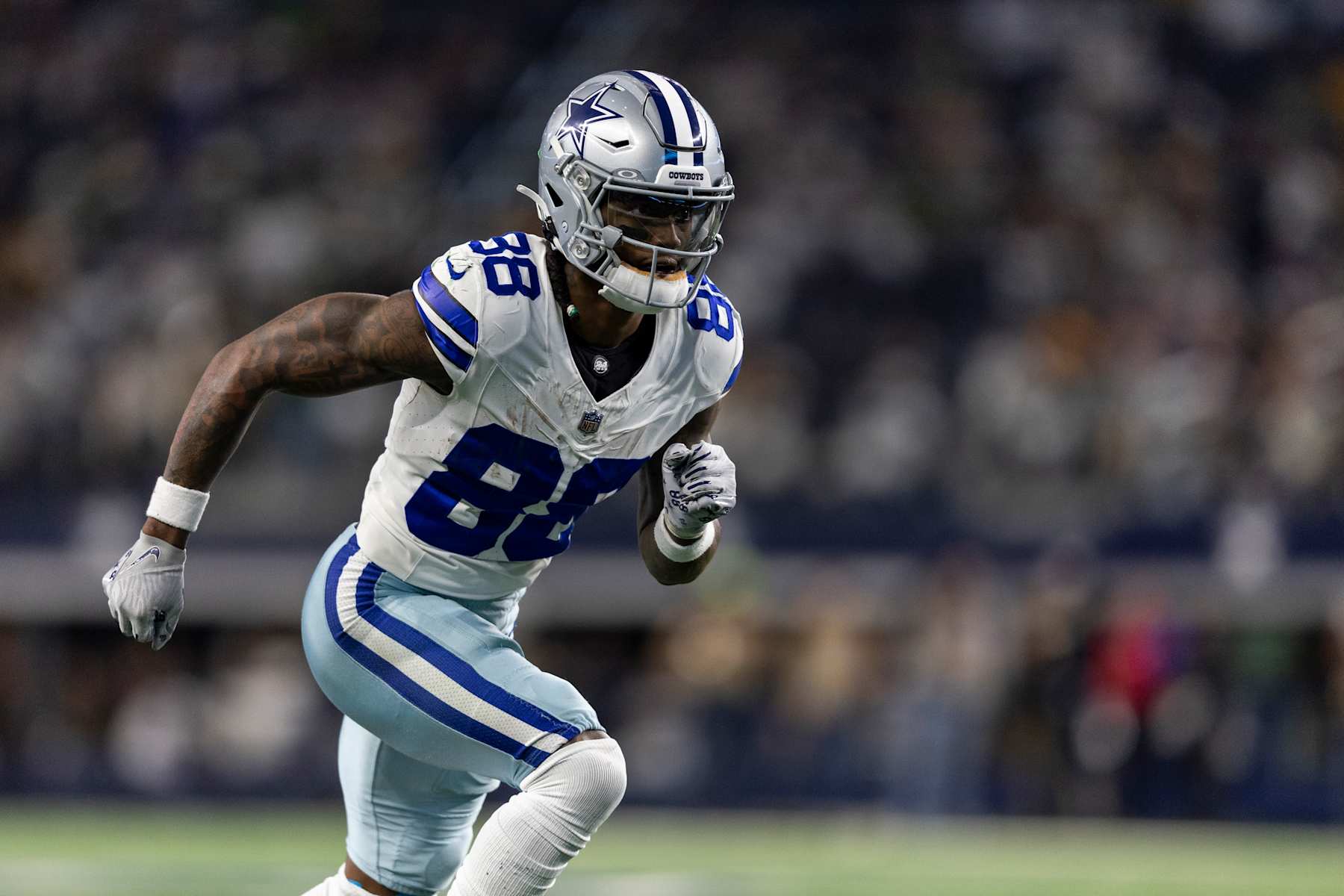 ARLINGTON, TEXAS - JANUARY 14: CeeDee Lamb #88 of the Dallas Cowboys runs a route during an NFL wild-card playoff football game between the Dallas Cowboys and the Green Bay Packers at AT&T Stadium on January 14, 2024 in Arlington, Texas. (Photo by Michael Owens/Getty Images)