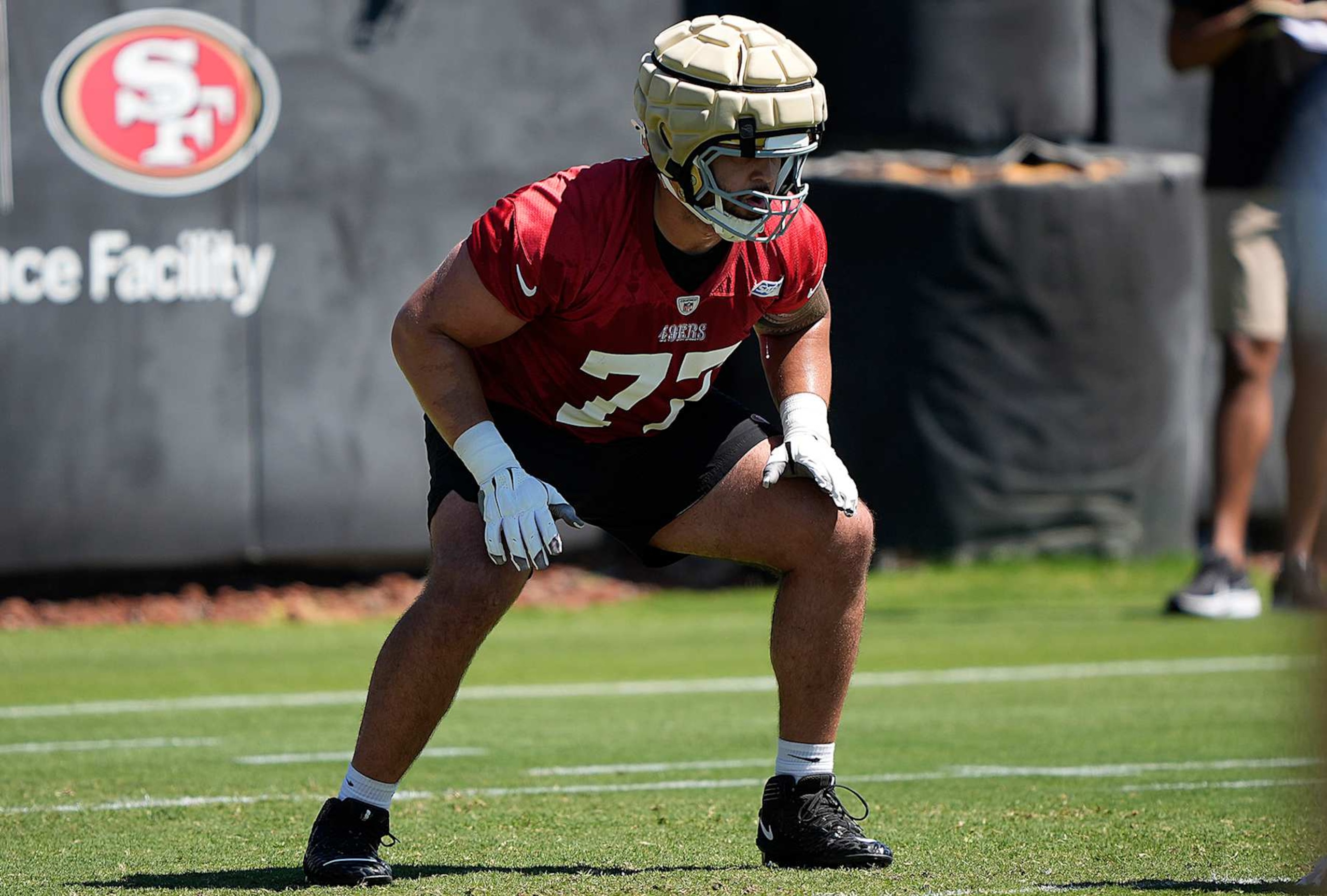 SANTA CLARA, CALIFORNIA - JUNE 04: Dominick Puni #77 of the San Francisco 49ers works out during mini camp on June 04, 2024 in Santa Clara, California. (Photo by Thearon W. Henderson/Getty Images)