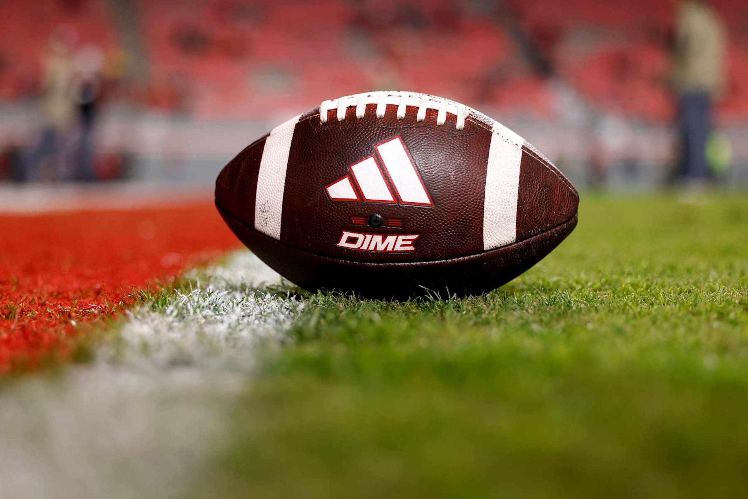RALEIGH, NORTH CAROLINA - NOVEMBER 4: A detailed view of an Adidas Dime football prior to the game between the Miami Hurricanes and the NC State Wolfpack at Carter-Finley Stadium on November 4, 2023 in Raleigh, North Carolina. NC State won 20-6. (Photo by Lance King/Getty Images)