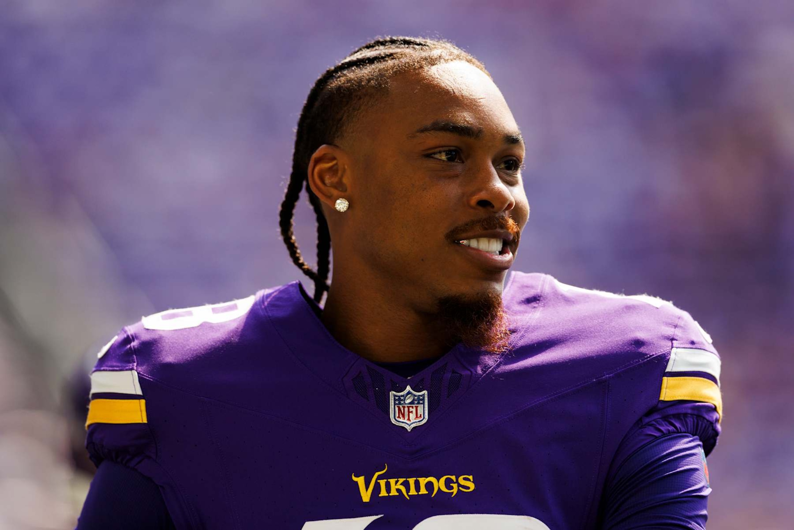 MINNEAPOLIS, MINNESOTA - AUGUST 10: Justin Jefferson #18 of the Minnesota Vikings on the sideline during a preseason game against the Las Vegas Raiders at U.S. Bank Stadium on August 10, 2024 in Minneapolis, Minnesota. (Photo by Ric Tapia/Getty Images)