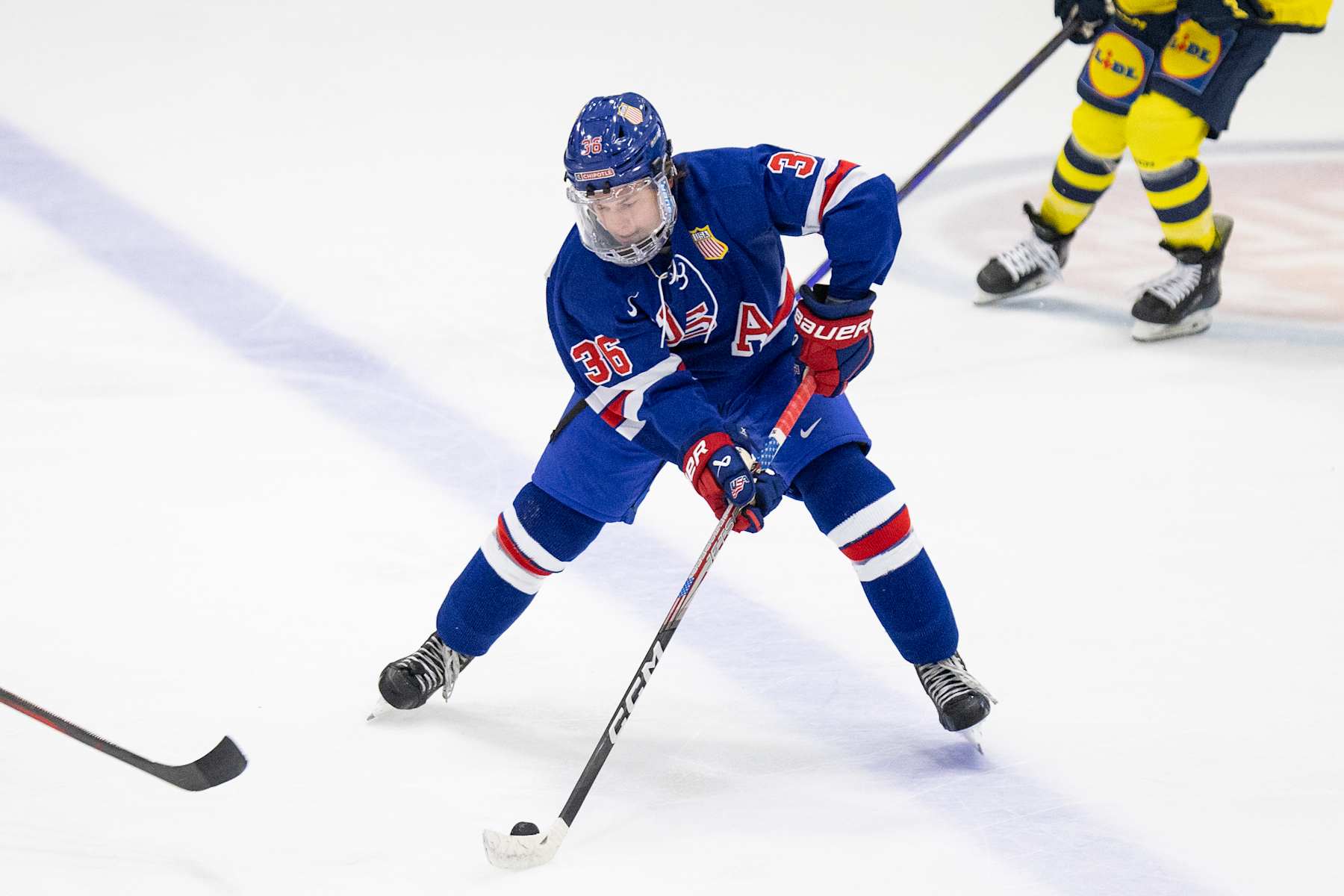 PLYMOUTH, MI - AUGUST 2: LJ Mooney #36 of Team USA makes a pass during the 2024 World Junior Summer Showcase between Sweden and USA at USA Hockey Arena on August 2, 2024 in Plymouth, Michigan. (Photo by Michael Miller/ISI Photos/Getty Images)