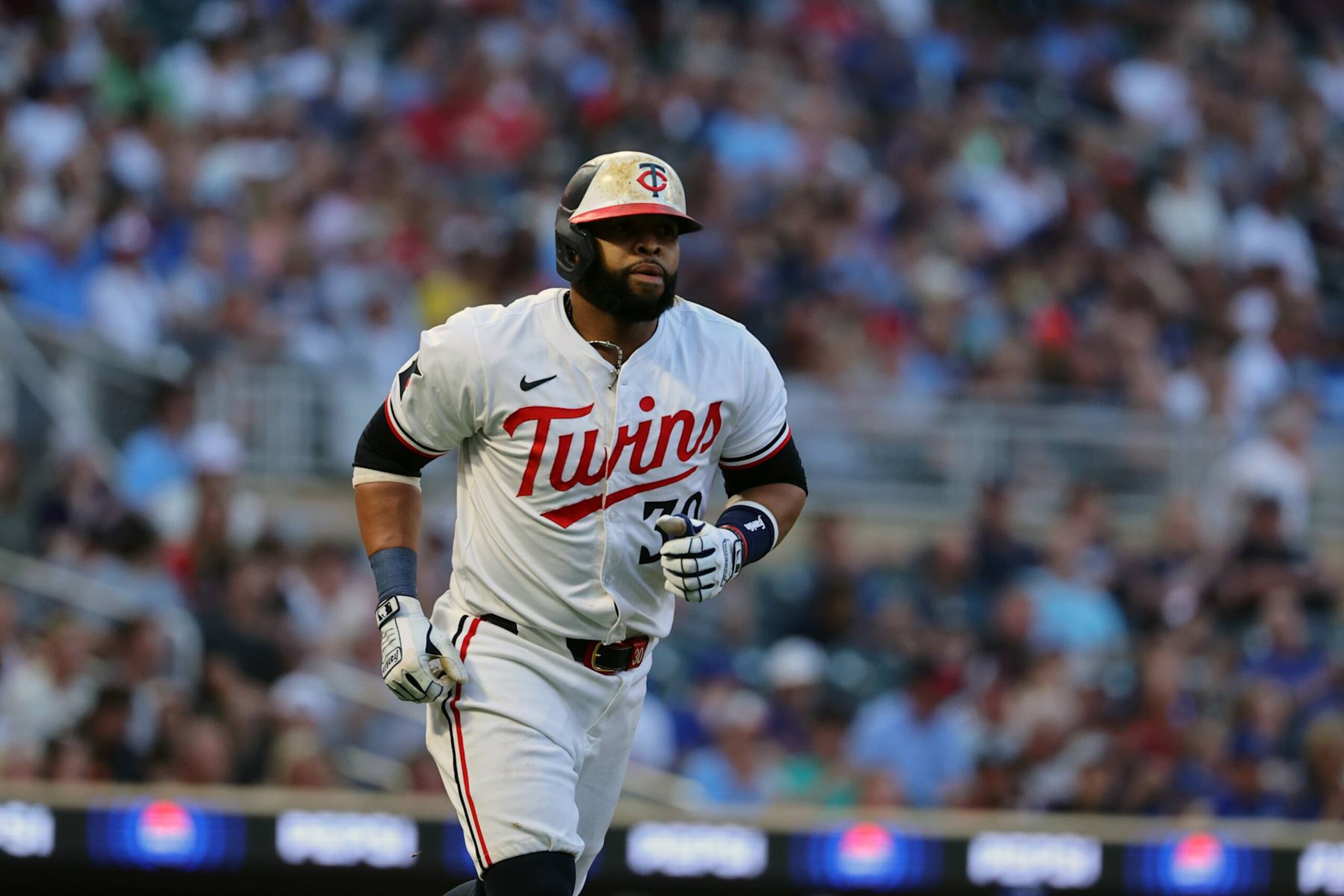 MINNEAPOLIS, MN - AUGUST 13: Carlos Santana #30 of the Minnesota Twins walks in the fifth inning against the Kansas City Royals at Target Field on August 13, 2024 in Minneapolis, Minnesota.(Photo by Adam Bettcher/Getty Images) MINNEAPOLIS, MN - AUGUST 13: Carlos Santana #30 of the Minnesota Twins walks in the fifth inning against the Kansas City Royals at Target Field on August 13, 2024 in Minneapolis, Minnesota.(Photo by Adam Bettcher/Getty Images)