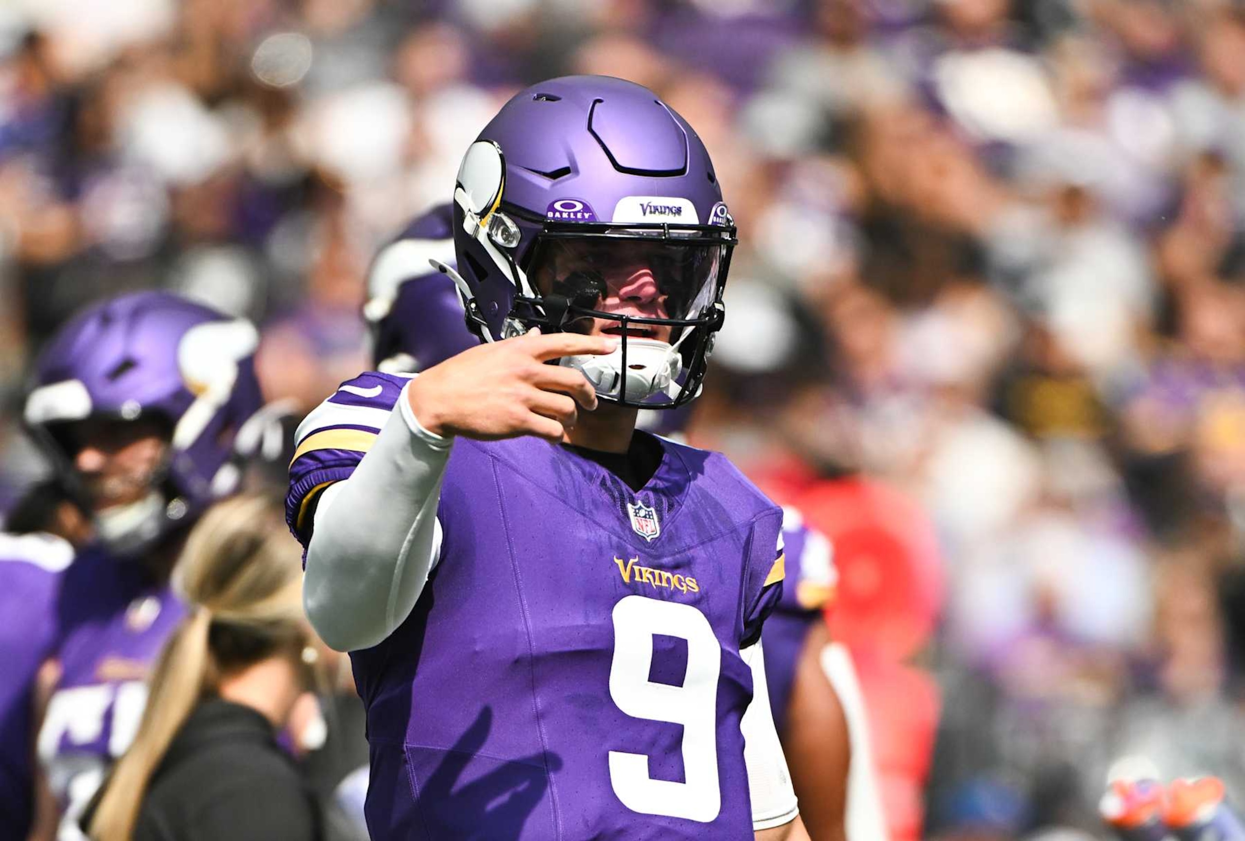MINNEAPOLIS, MINNESOTA - AUGUST 10: J.J. McCarthy #9 of the Minnesota Vikings speaks to coaches on the sideline in the second quarter of the preseason game against the Las Vegas Raiders at U.S. Bank Stadium on August 10, 2024 in Minneapolis, Minnesota. (Photo by Stephen Maturen/Getty Images)